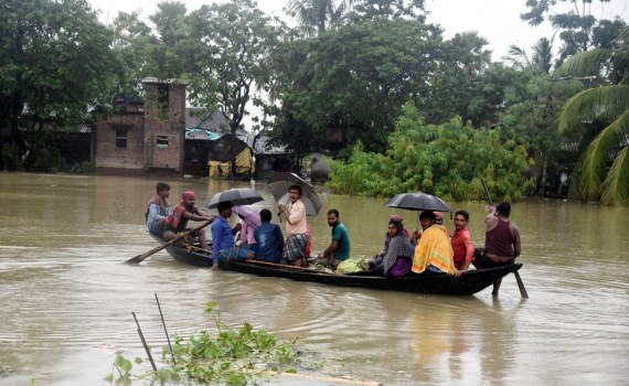 Villagers take a boat on floodwaters to a safer place in Hoogly district of India's West Bengal State on Aug. 4, 2021.