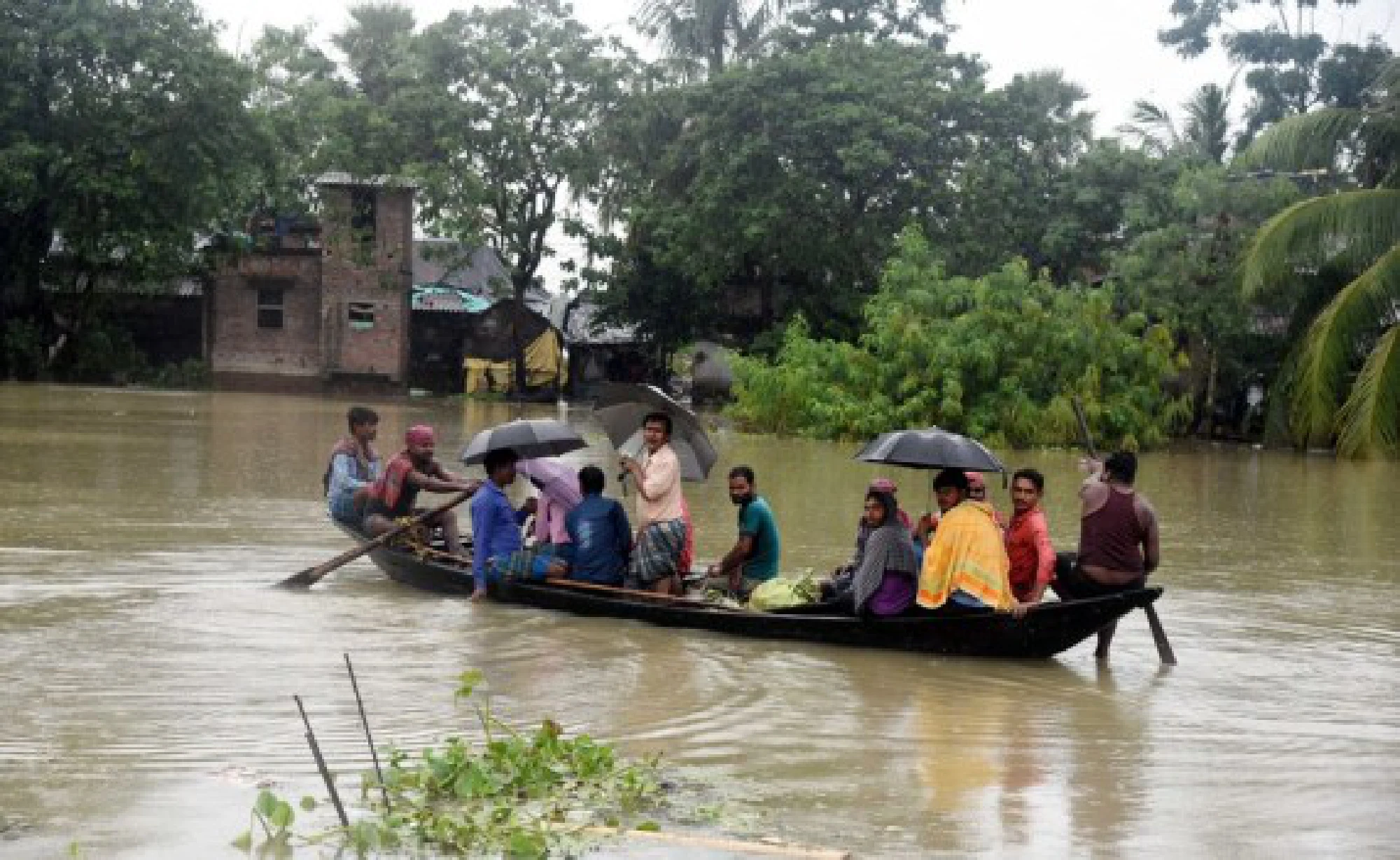 Villagers take a boat on floodwaters to a safer place in Hoogly district of India's West Bengal State on Aug. 4, 2021.
