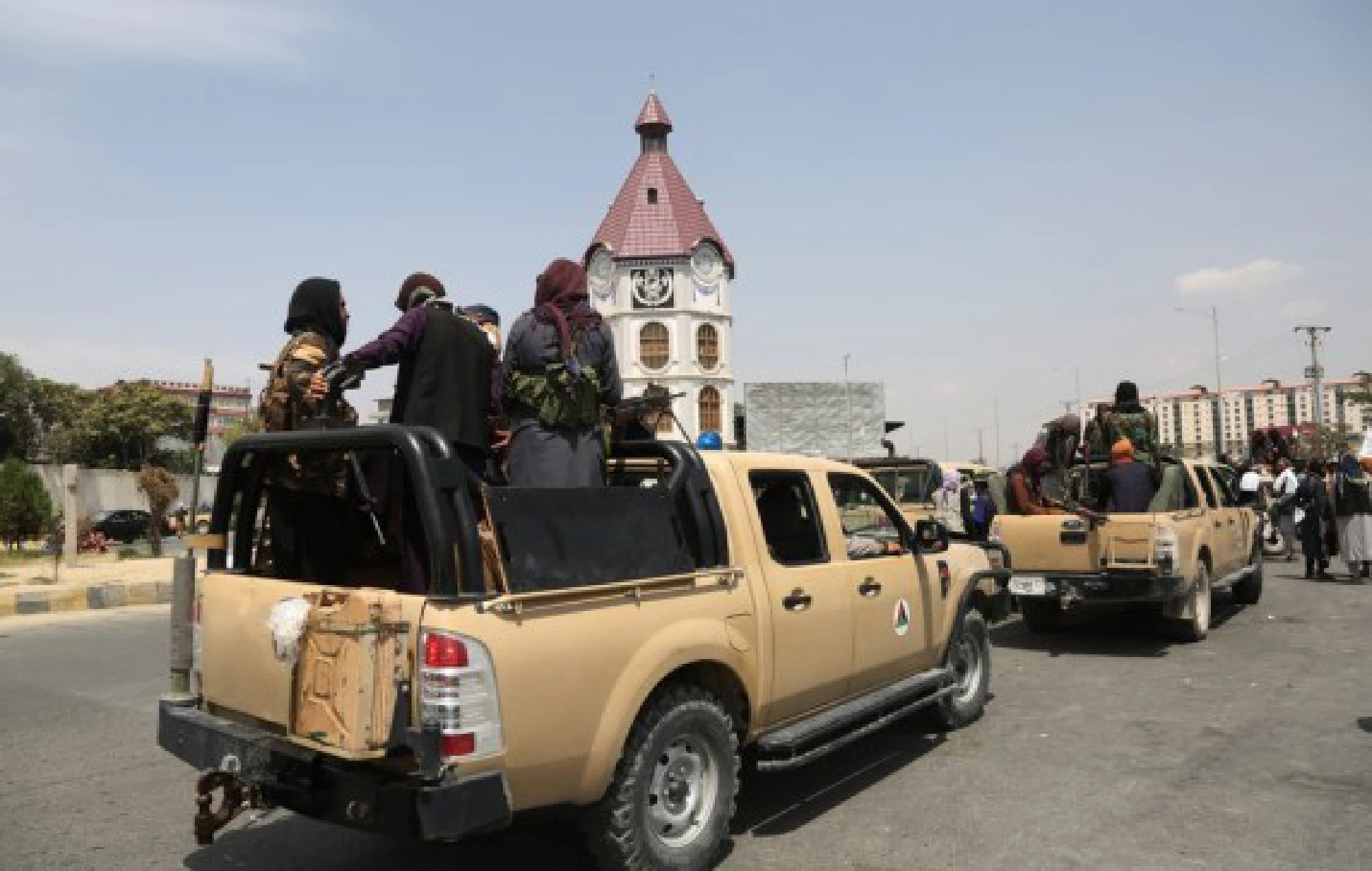 Afghan Taliban members are seen at a security checkpoint in Kabul, Afghanistan, Aug. 20, 2021. 