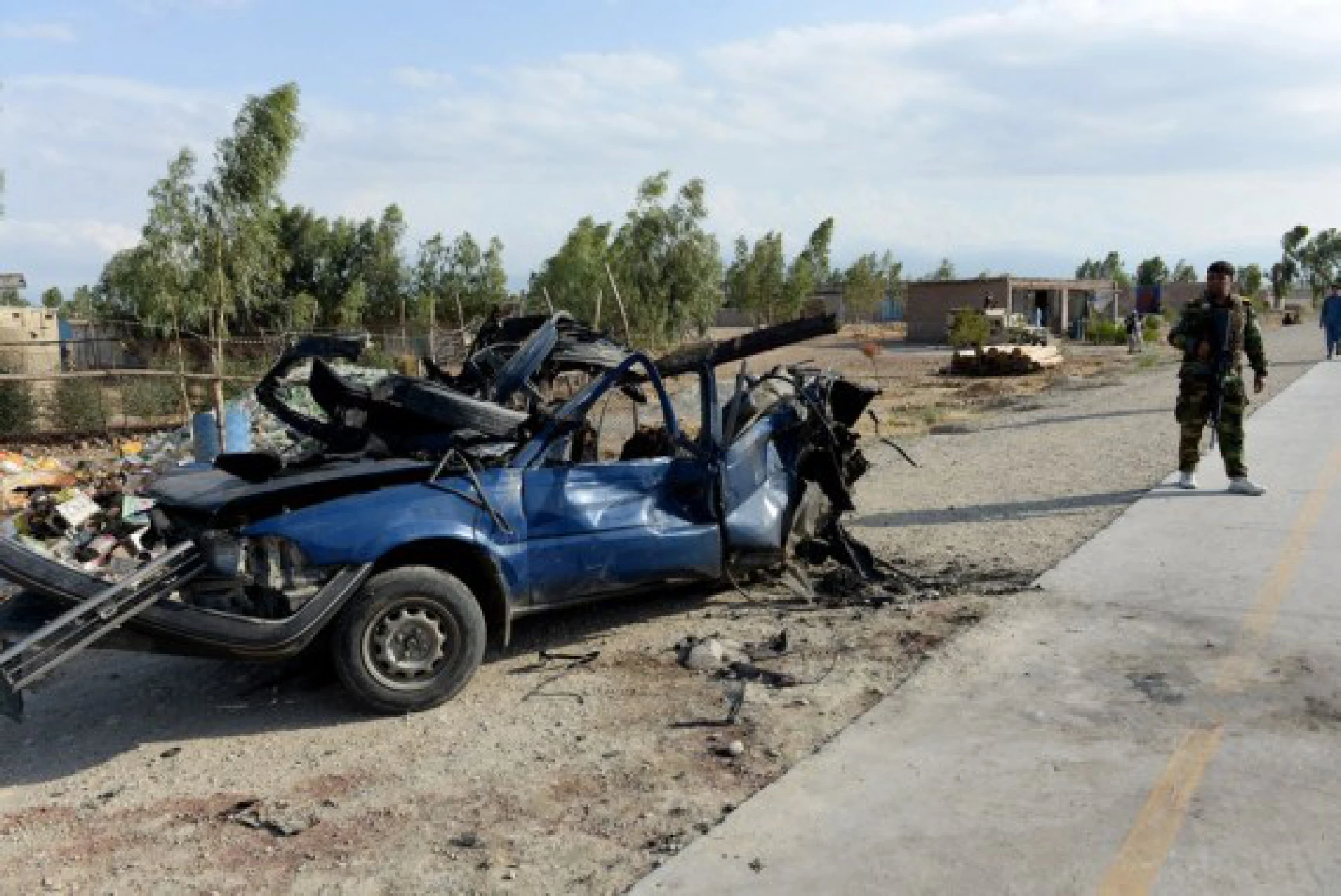 Photo taken on July 21, 2021 shows a damaged vehicle at the site of a bomb explosion in Khogiani district of Nangarhar province, Afghanistan. 