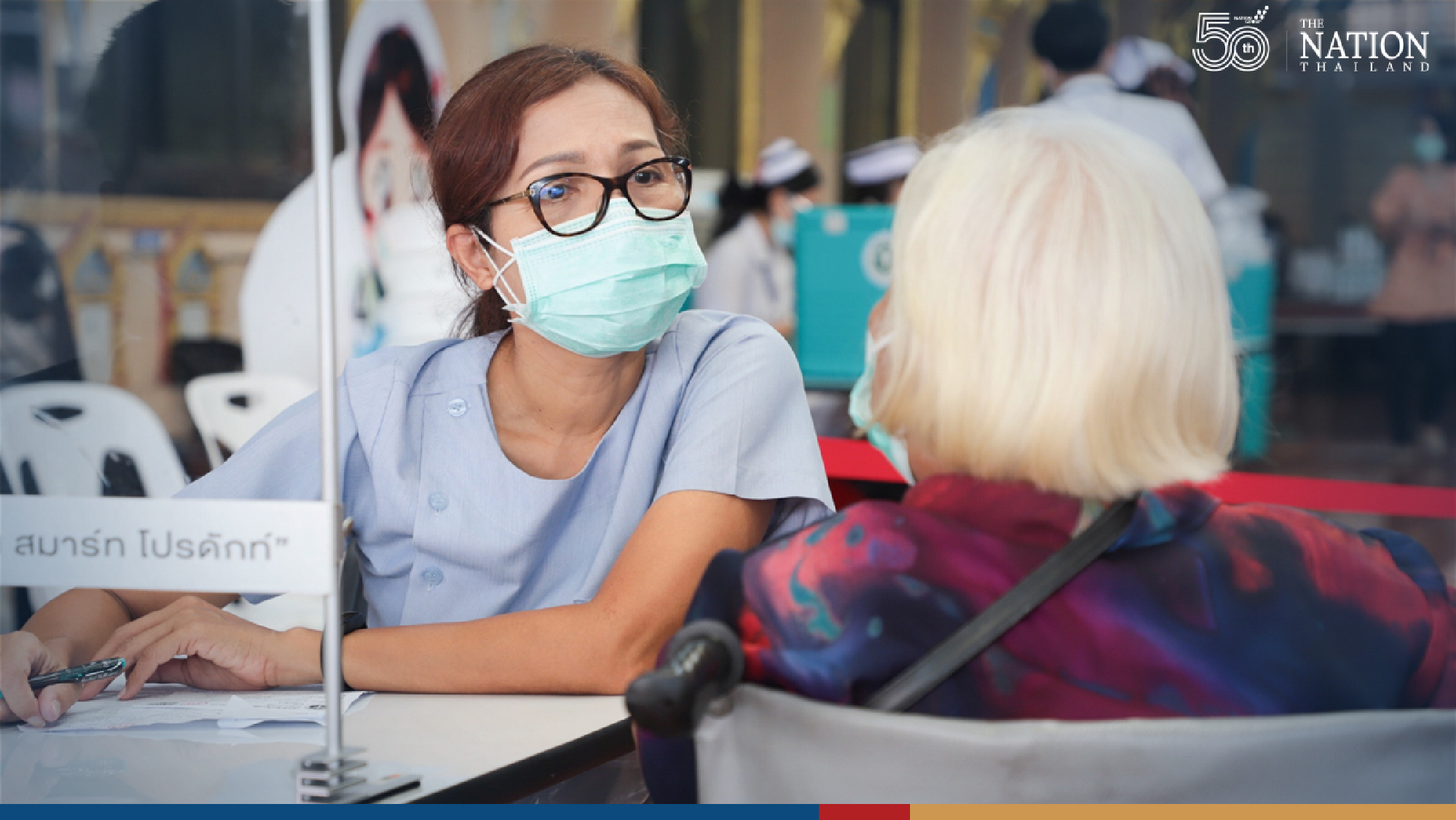 Long queue fails to deter elderly seeking Pfizer vaccine in Samut Prakan