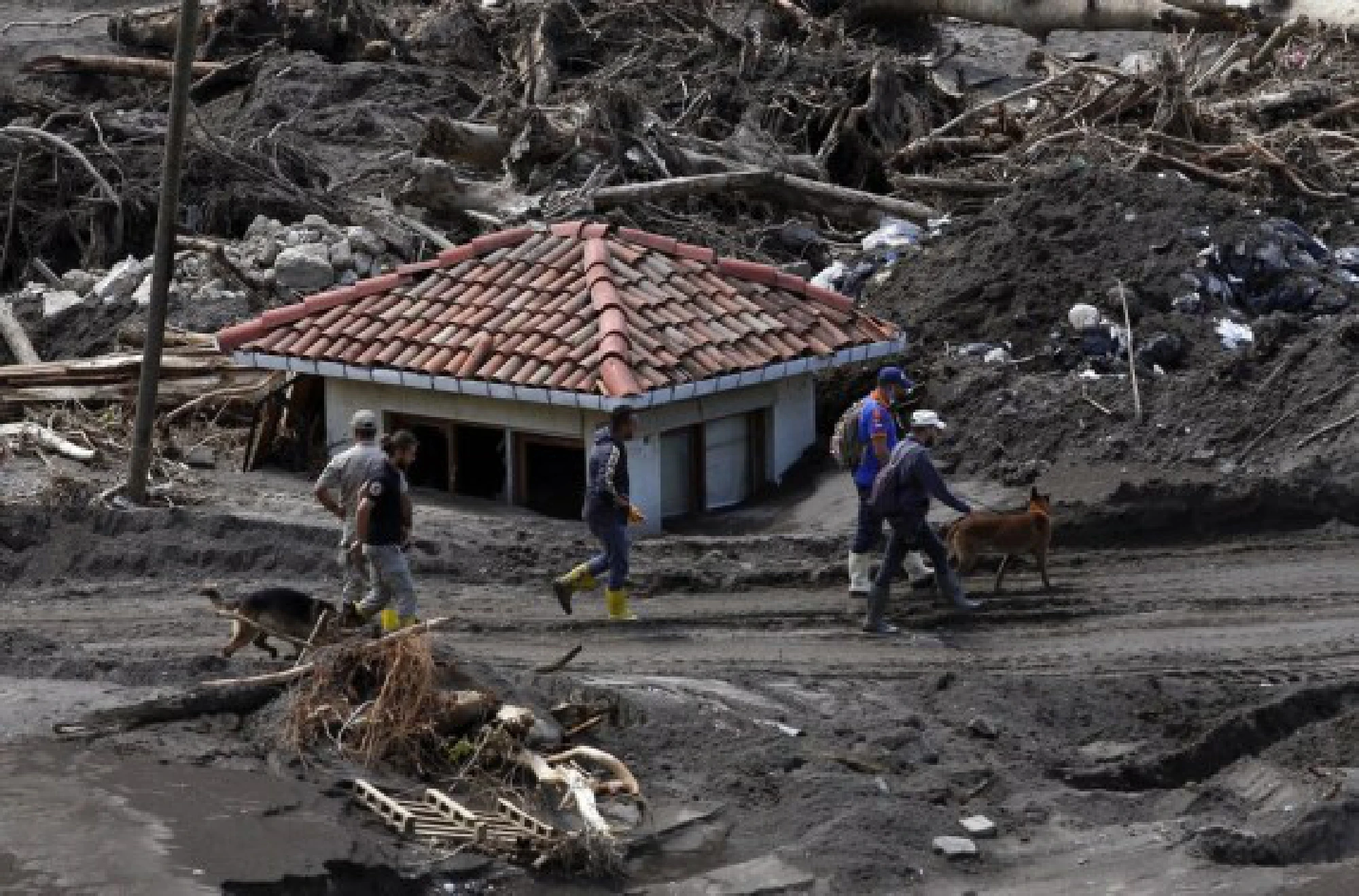 Rescue workers search for survivors in the flood-hit town of Bozkurt, Kastamonu province, Turkey, Aug. 14, 2021. 