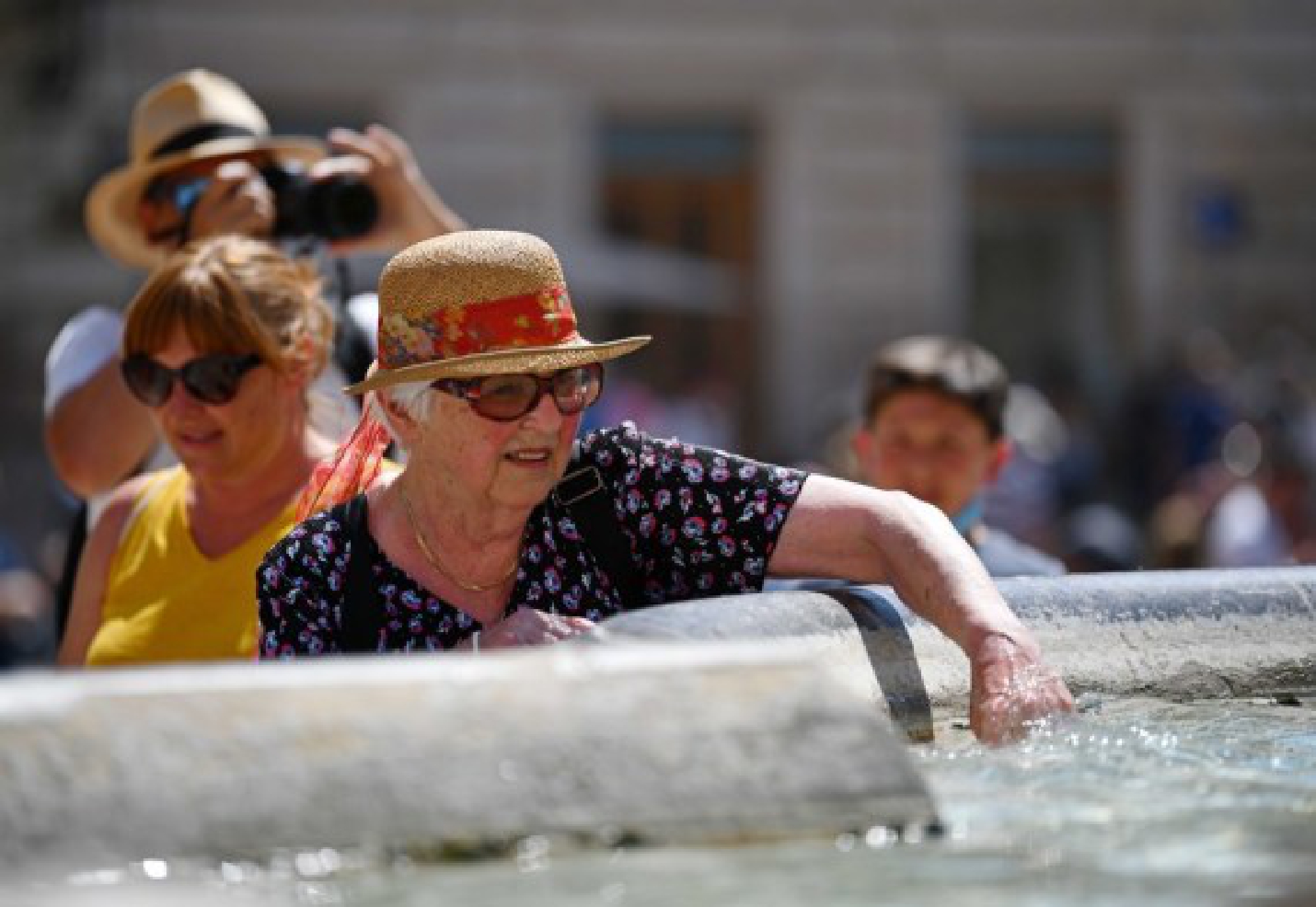  A tourist cools off by a fountain near the Pantheon in Rome, Italy, Aug. 12, 2021. 