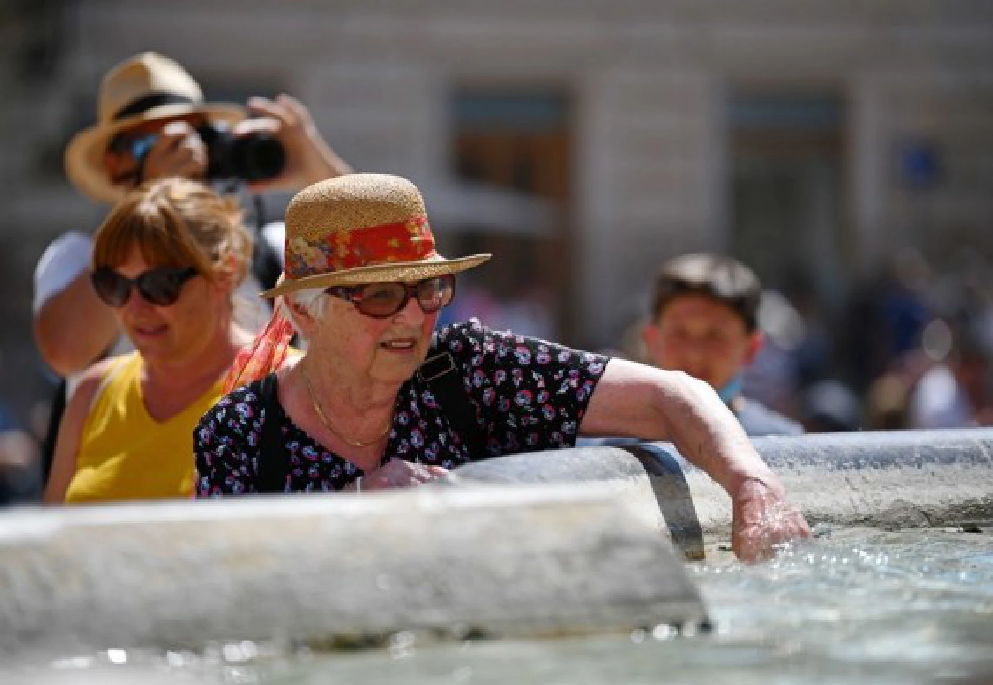  A tourist cools off by a fountain near the Pantheon in Rome, Italy, Aug. 12, 2021. 