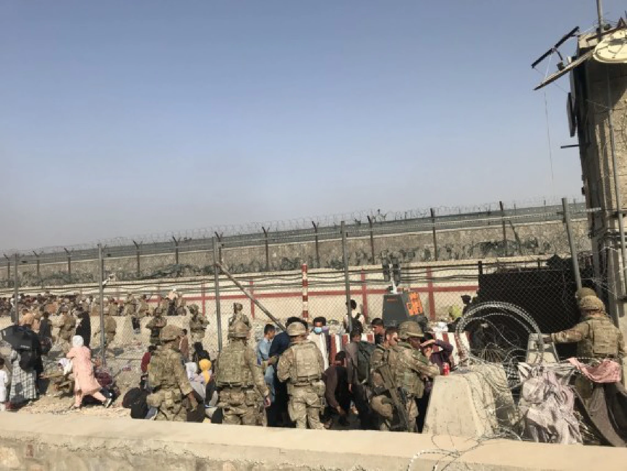 Afghans enter Kabul airport in Kabul, Afghanistan, Aug. 22, 2021. Seven Afghan civilians were killed amid chaos near the Kabul airport as people swarmed the area in hopes of boarding an evacuation flight following the Taliban takeover of Afghanistan, Britain's Ministry of Defense said Sunday. (