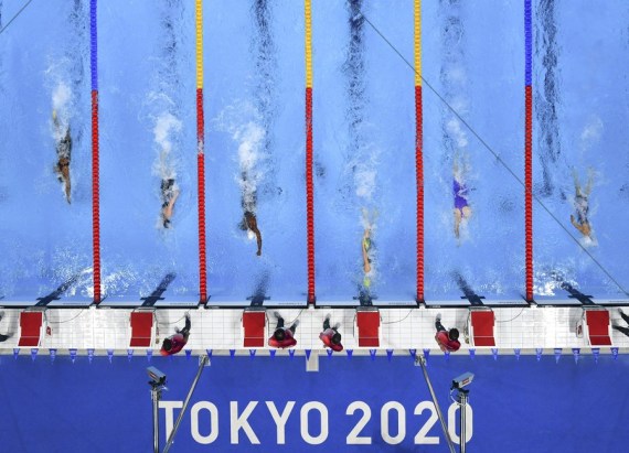 Emma McKeon (3rd R) of Australia competes during the heat of women's 50m freestyle of swimming event at Tokyo 2020 Olympic Games in Tokyo, Japan, July 30, 2021. 