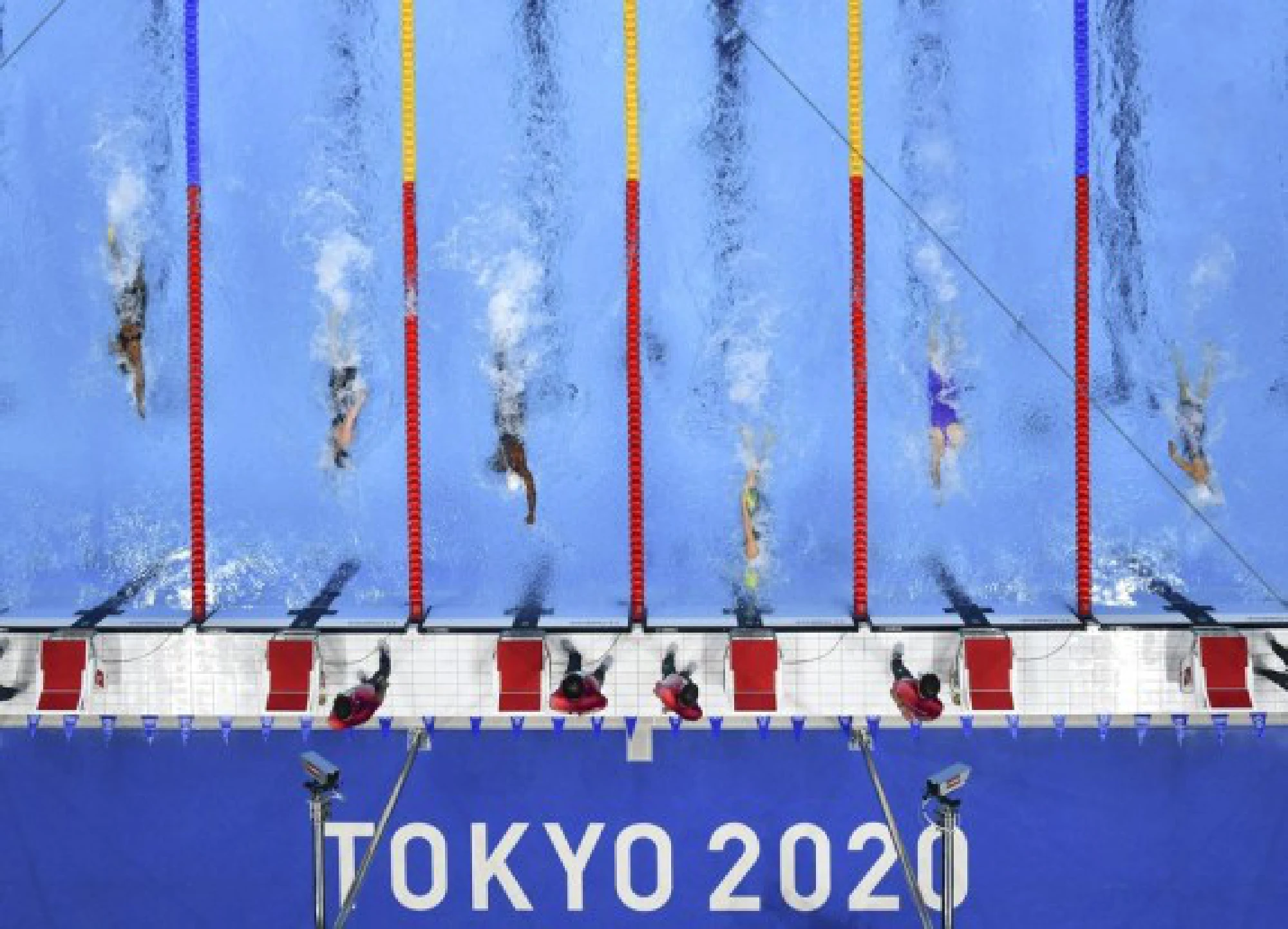 Emma McKeon (3rd R) of Australia competes during the heat of women's 50m freestyle of swimming event at Tokyo 2020 Olympic Games in Tokyo, Japan, July 30, 2021. 