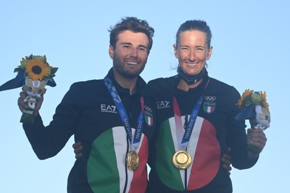 Ruggero Tita (L) and Caterina Banti of Italy pose with their gold medals after sailing's Mixed Multihull-Nacra 17 Foiling event at Tokyo 2020 in Kanagawa, Japan, Aug. 3, 2021.