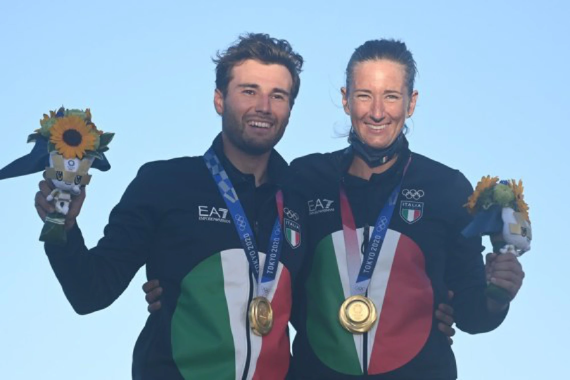 Ruggero Tita (L) and Caterina Banti of Italy pose with their gold medals after sailing's Mixed Multihull-Nacra 17 Foiling event at Tokyo 2020 in Kanagawa, Japan, Aug. 3, 2021.