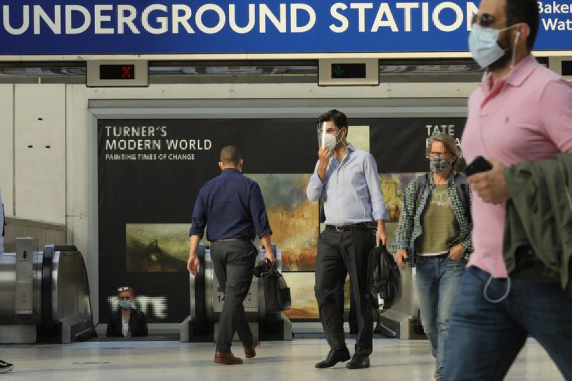 Passengers walk at Waterloo train station in London, Britain, on Aug. 5, 2021. 