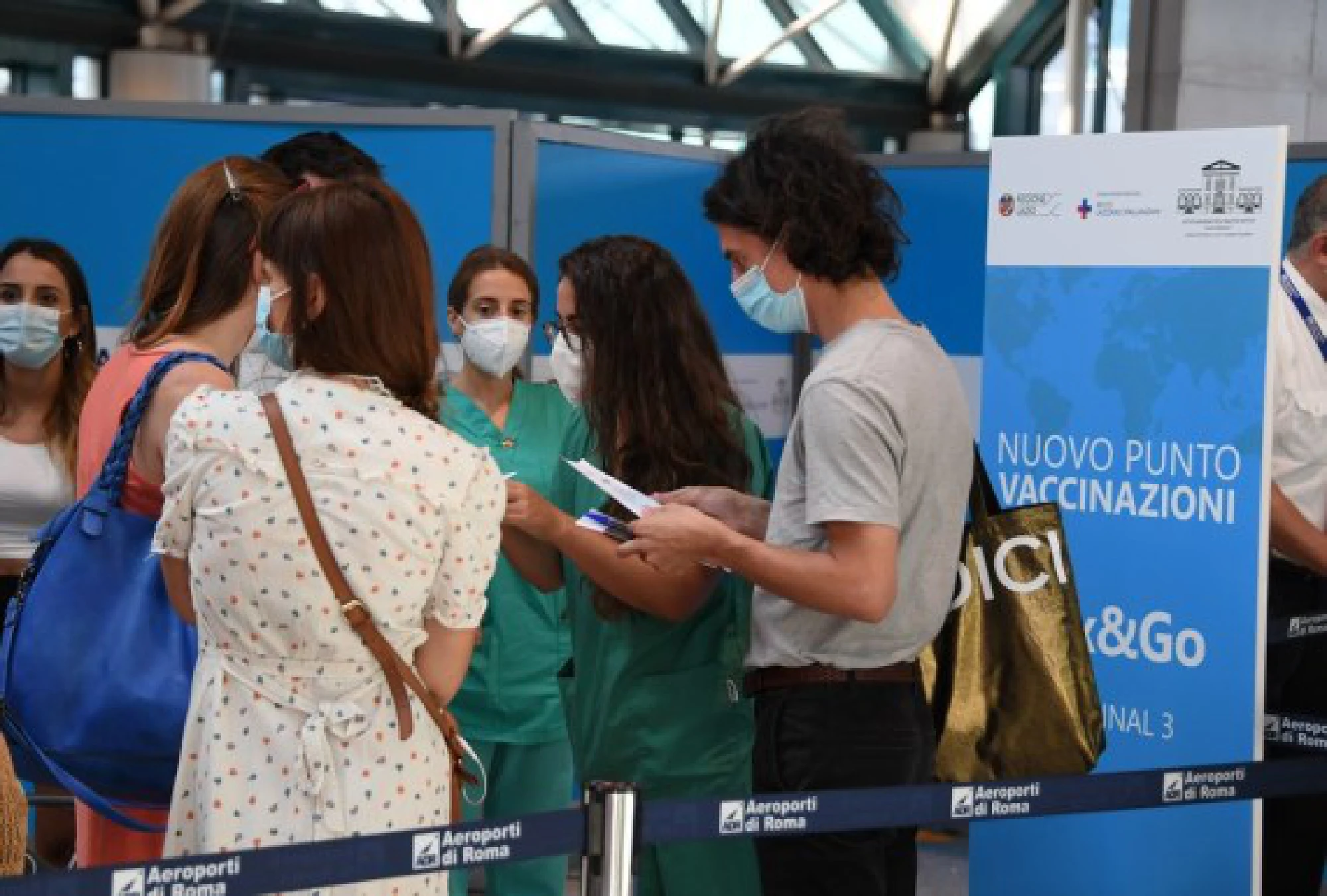 Passengers wait to receive COVID-19 vaccine at the Fiumicino airport in Rome, Italy, July 29, 2021.
