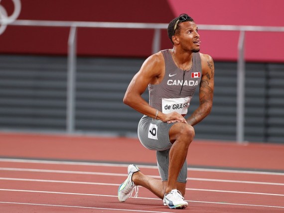 Andre de Grasse of Canada reacts after the men's 200m final at Tokyo 2020 Olympic Games, in Tokyo, Japan, Aug. 4, 2021. 