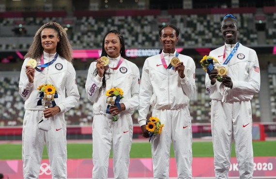 Gold medalists Team USA react on the awarding ceremony of the women's 4x400m relay at the Tokyo 2020 Olympic Games in Tokyo, Japan, Aug. 7, 2021.