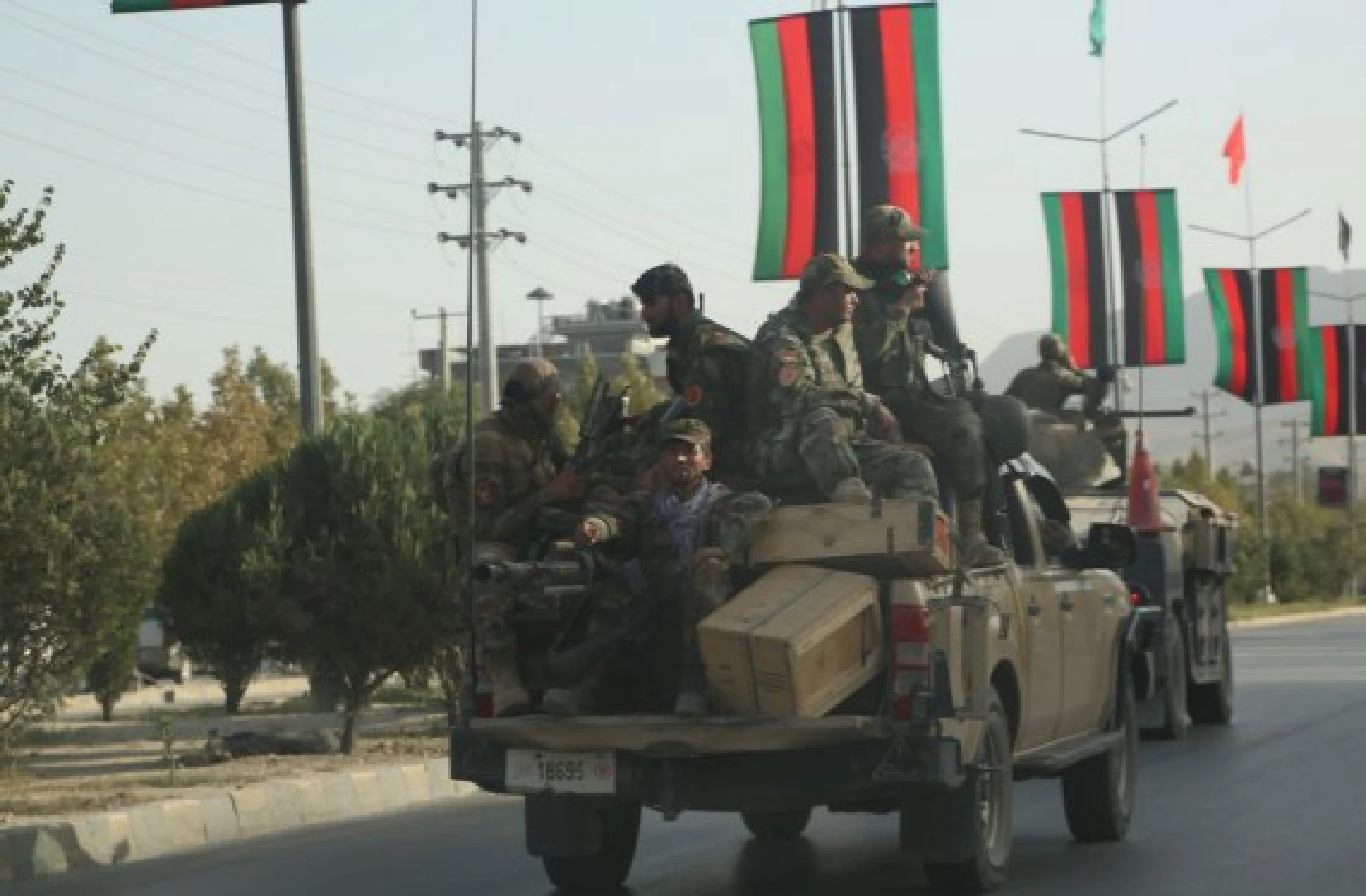 Afghan army vehicles are seen on a road in Kabul, capital of Afghanistan, on Aug. 15, 2021. 
