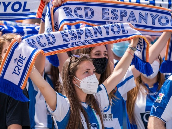 Supporters of RCD Espanyol cheer the team's return to the Spanish First Division at RCDE Stadium, Cornella, Spain, May 9, 2021.