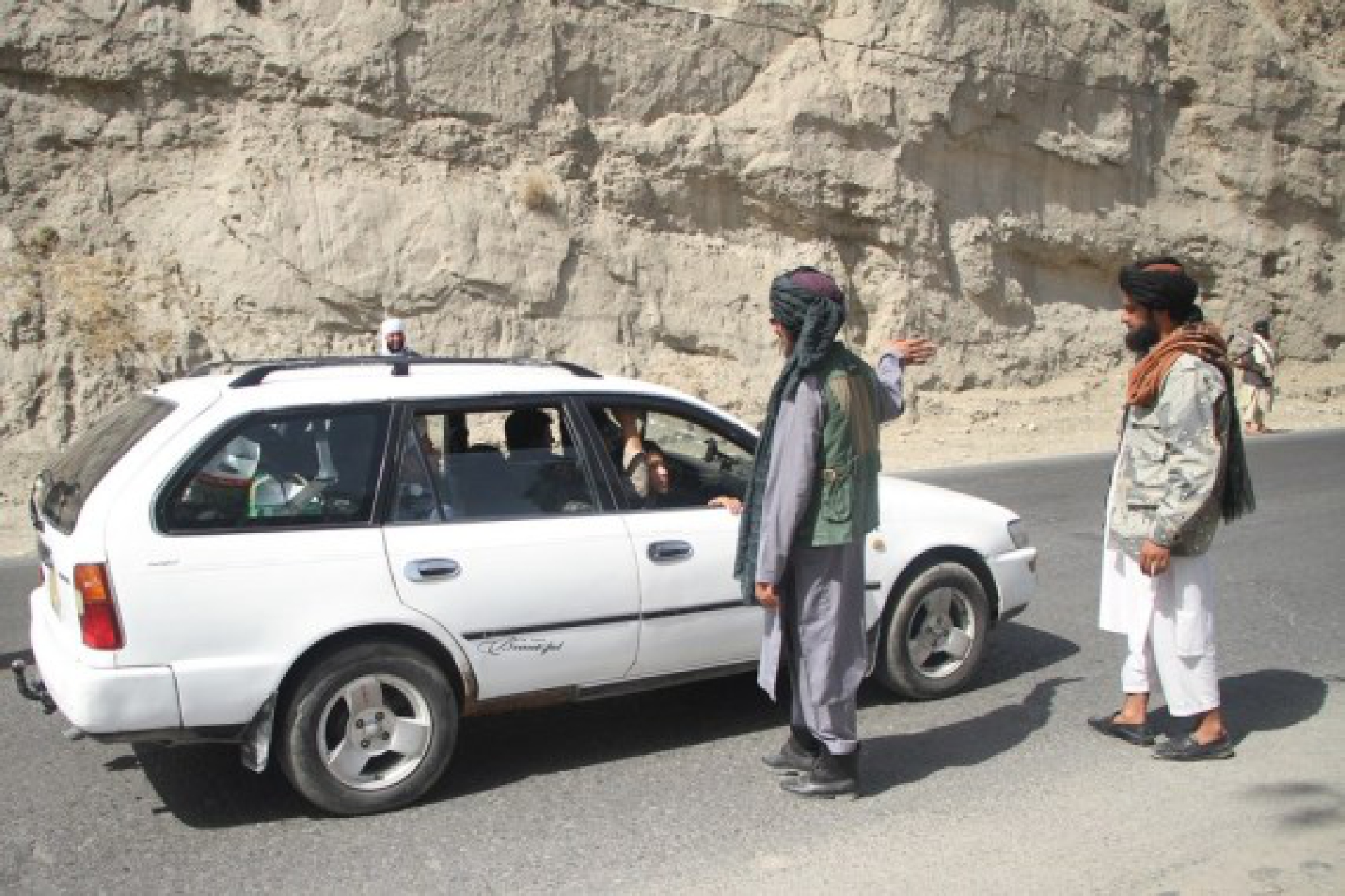 Afghan Taliban members are seen at a security checkpoint in Kabul, Afghanistan, Aug. 20, 2021. 
