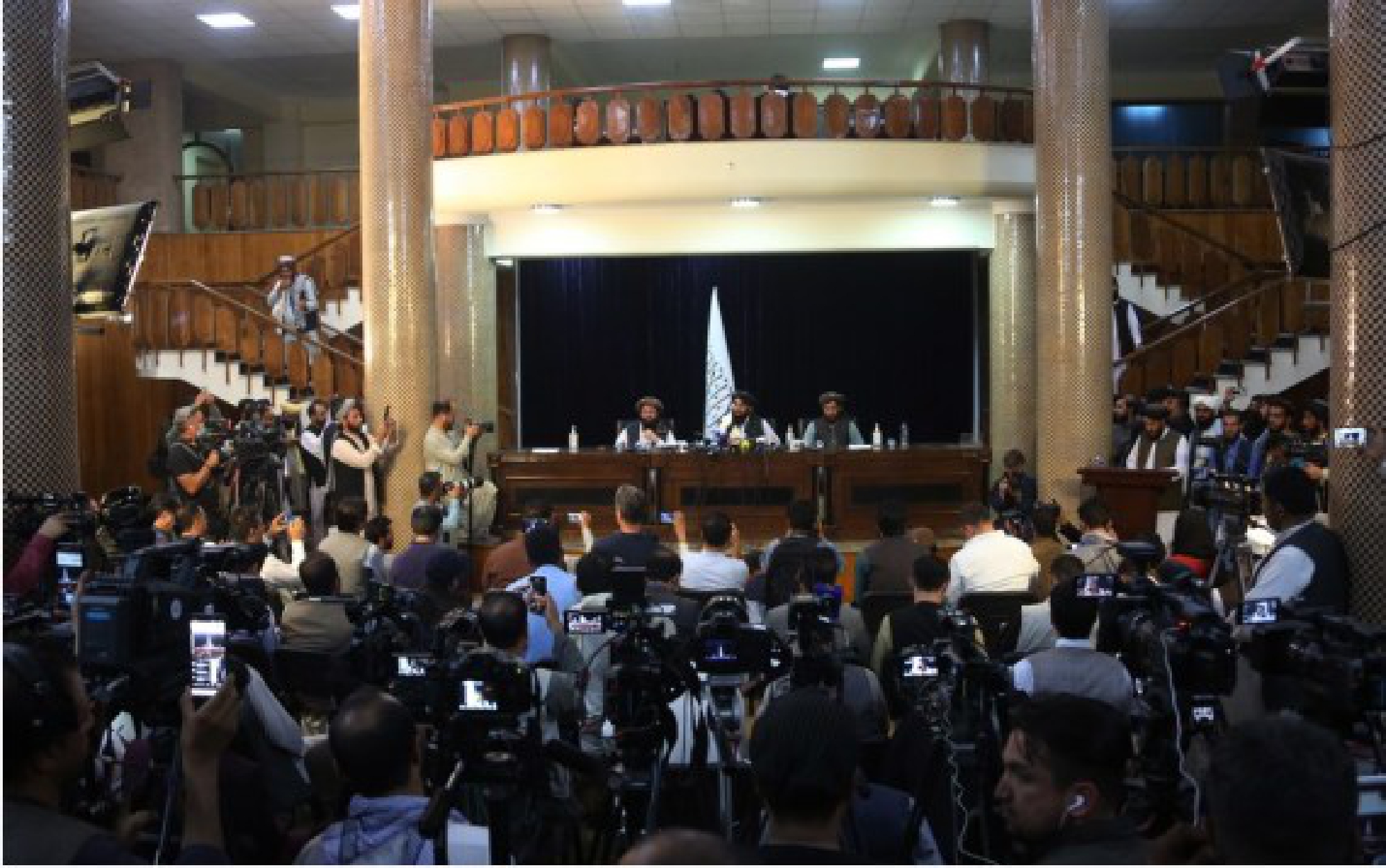 Taliban spokesman Zabihullah Mujahid (C, Rear) attends a press conference, his first public appearance,  in Kabul, capital of Afghanistan, on Aug. 17, 2021.
