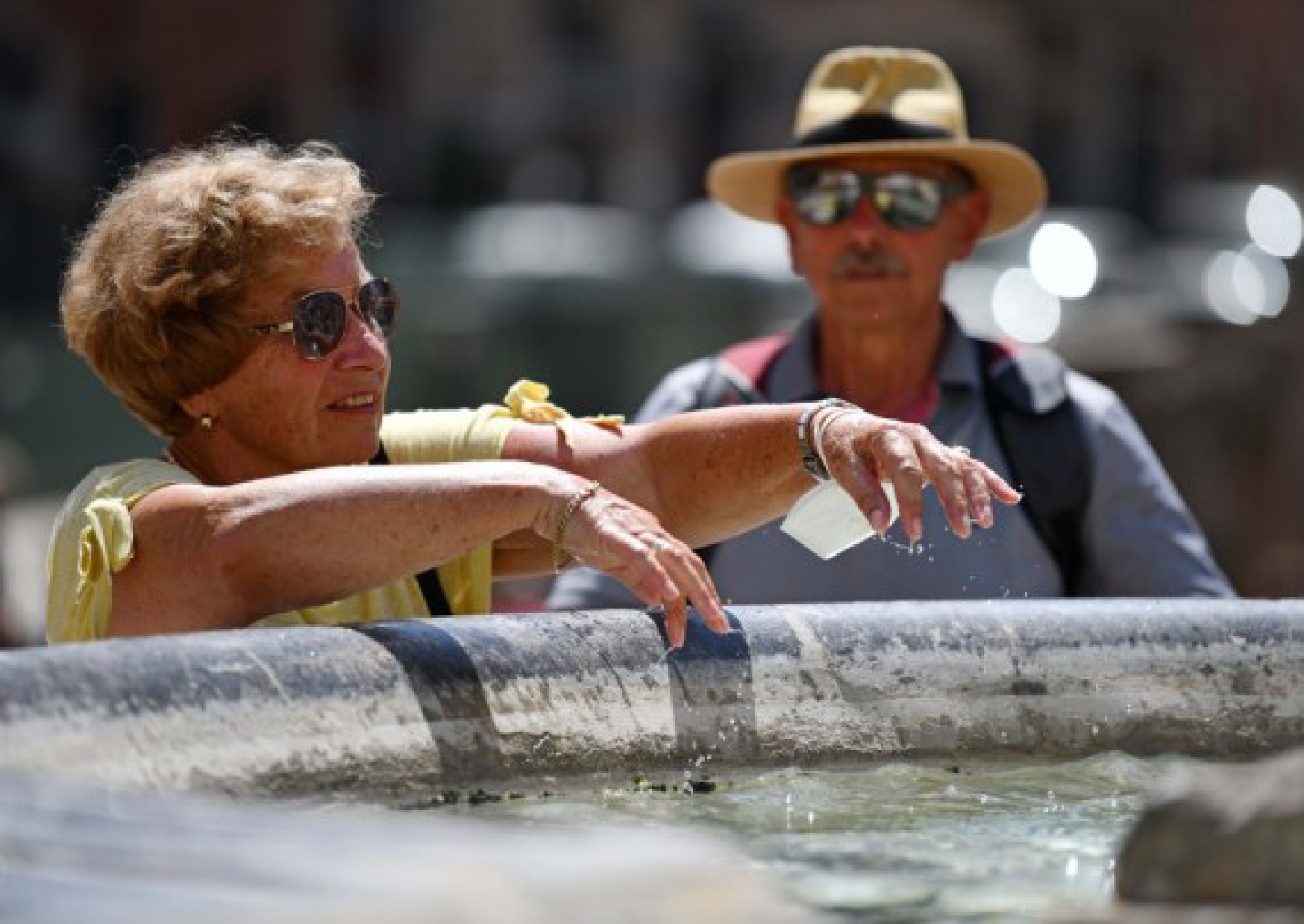  A tourist cools off by a fountain near the Pantheon in Rome, Italy, Aug. 12, 2021. 