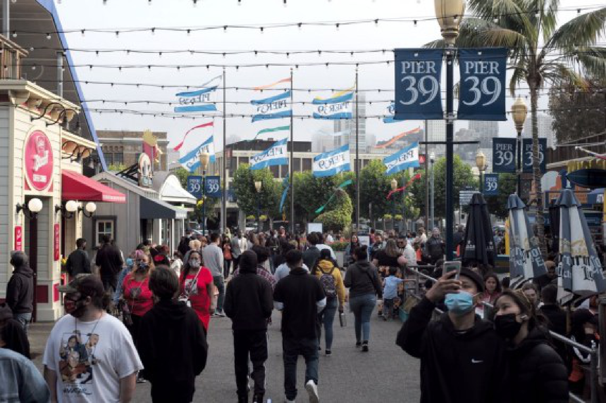 People spend their leisure time at a pier in San Francisco, the United States, on Aug. 15, 2021. 