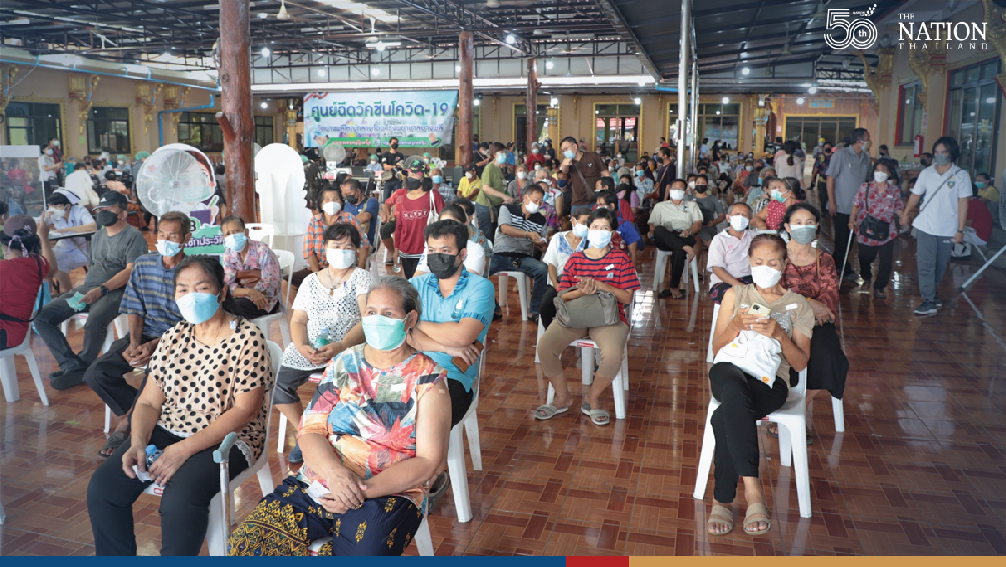 Long queue fails to deter elderly seeking Pfizer vaccine in Samut Prakan