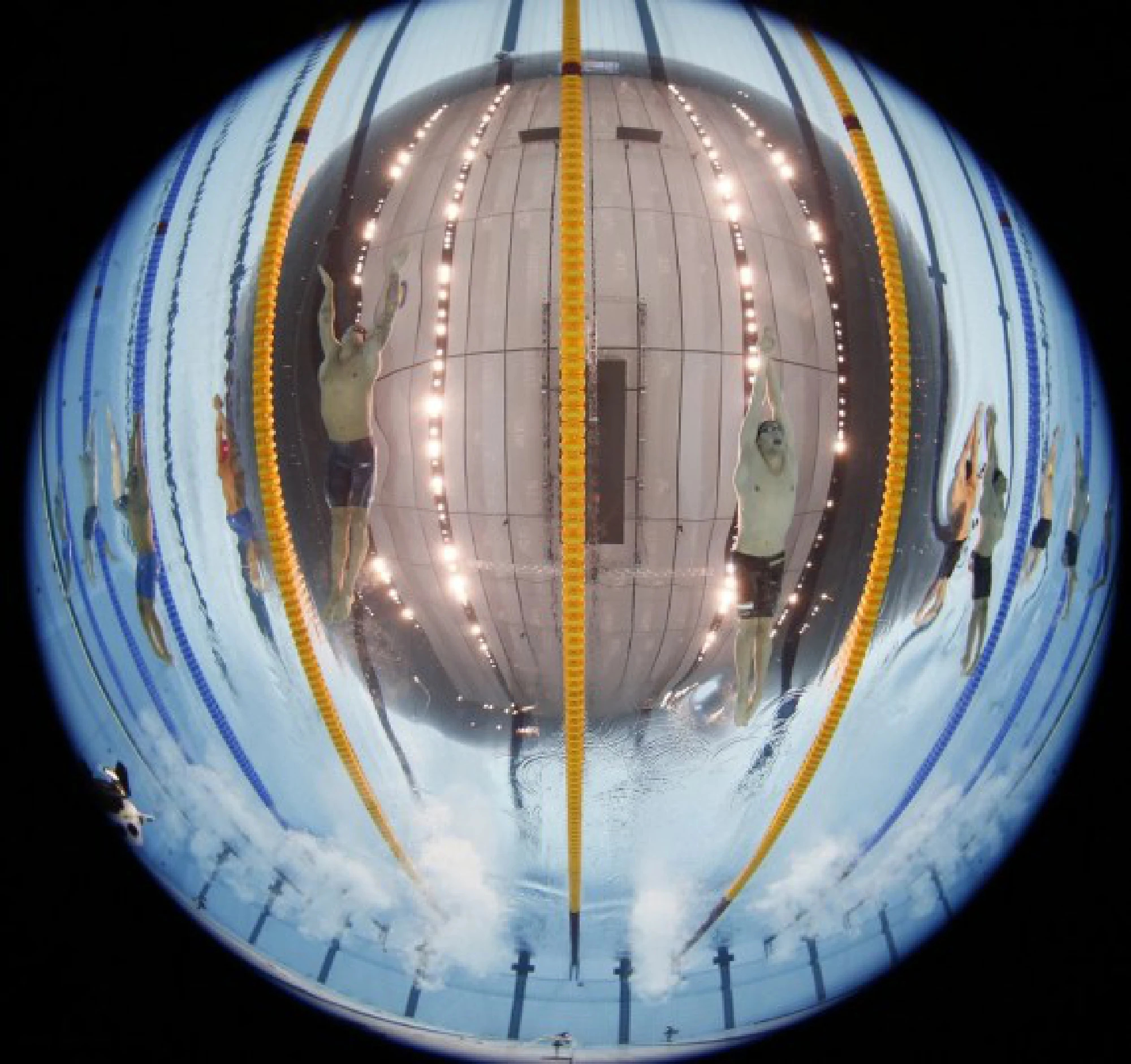 Caeleb Dressel (L, center) of the United States competes during the men's 100m butterfly final of swimming at the Tokyo 2020 Olympic Games in Tokyo, Japan, July 31, 2021.