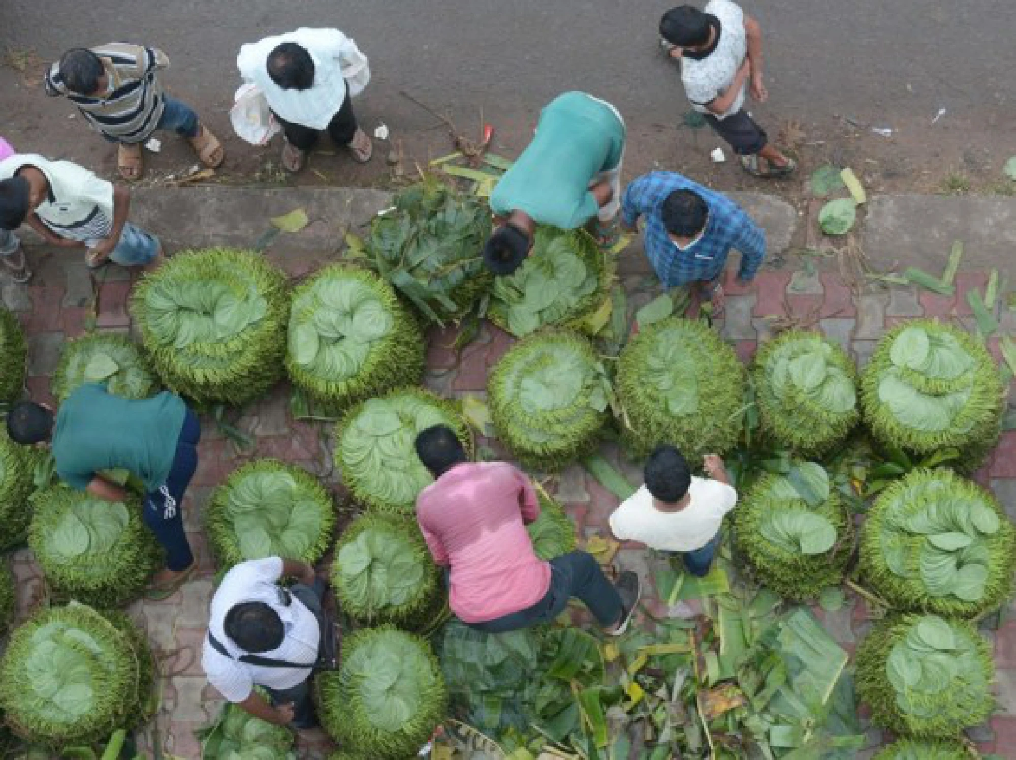 People sell betel leaves in a wholesale market in Agartala, capital city of India's northeastern state of Tripura, July 29, 2021.