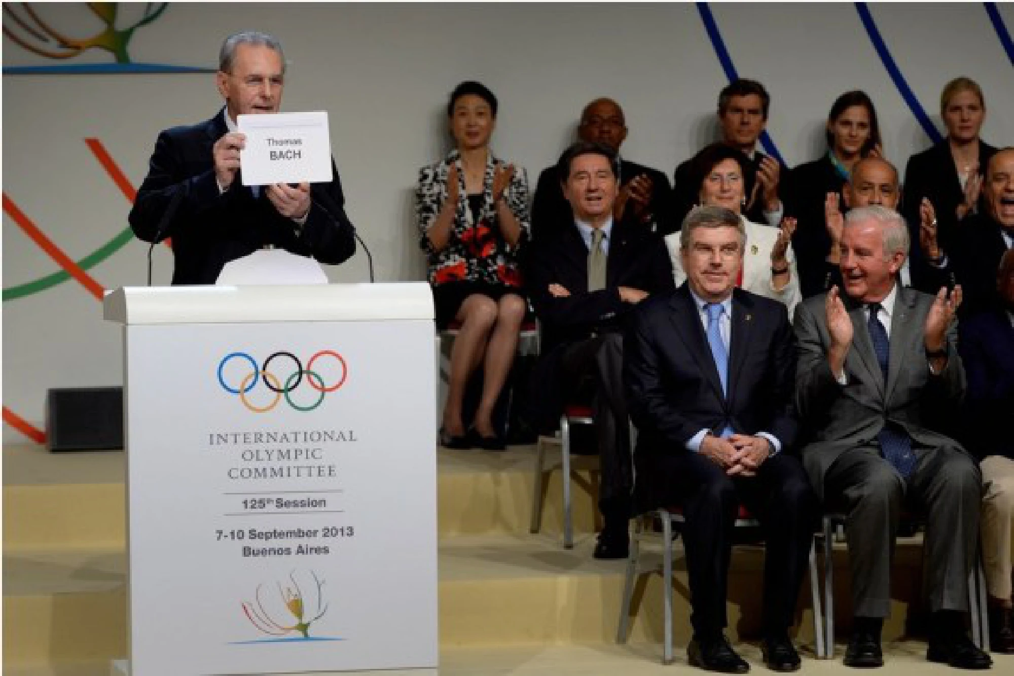 Outgoing International Olympic Committee (IOC) President Jacques Rogge (L) shows the name of new IOC President Thomas Bach during the announcement ceremony at the 125th IOC session in Buenos Aires, on September 10, 2013.