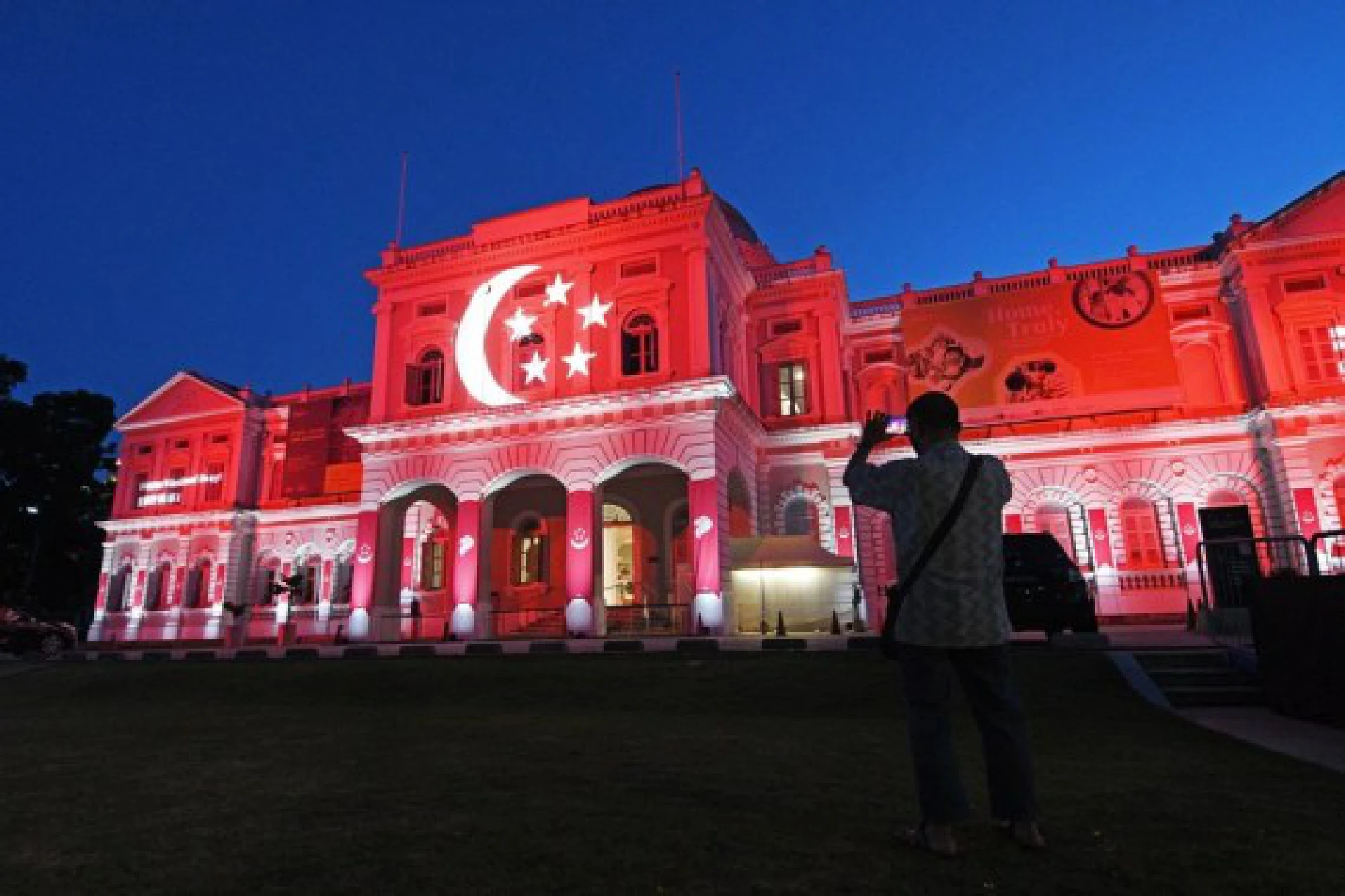 Photo taken on Aug. 10, 2021 shows light projections on the facade of the National Museum of Singapore in celebration of the country's 56th anniversary of independence. 