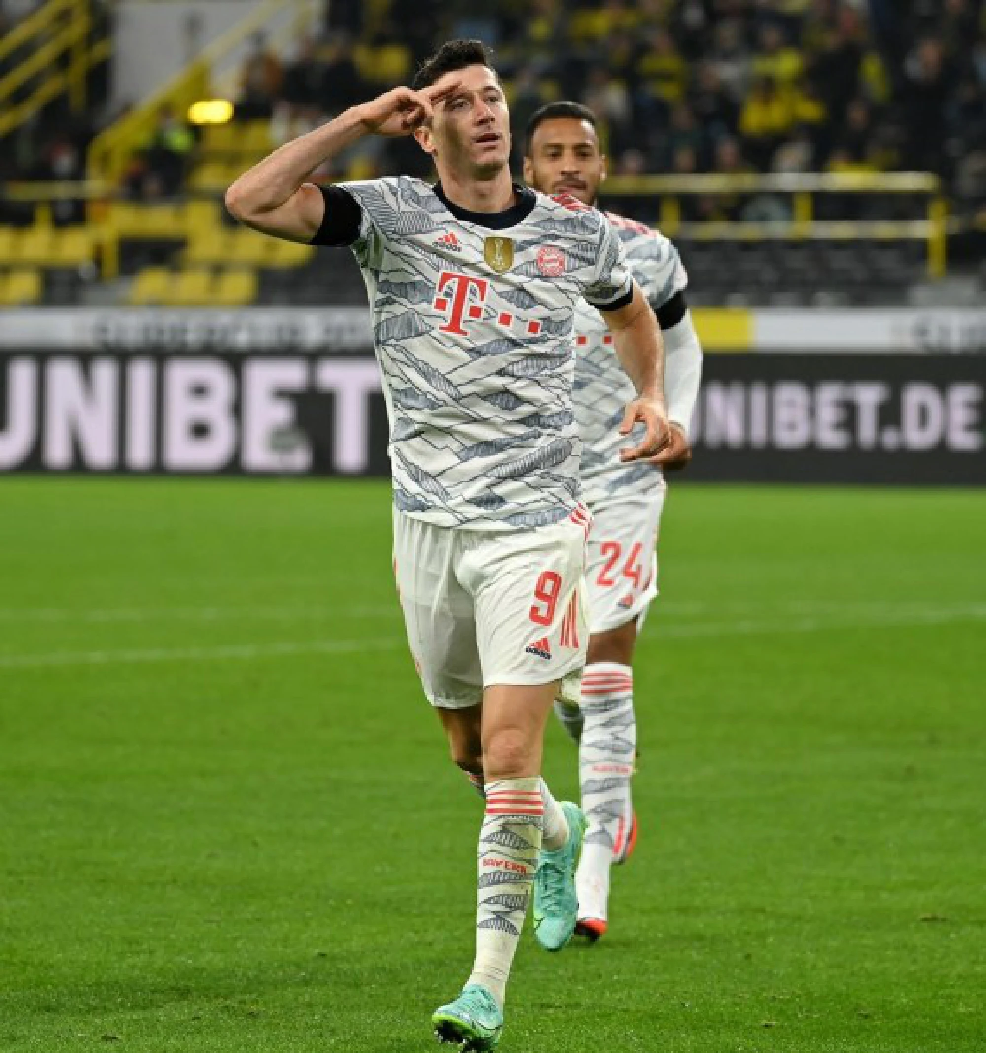 Robert Lewandowski (front) of Bayern Munich celebrates scoring during their German Supercup tie against Borussia Dortmund in Dortmund, Germany, Aug. 17, 2021. 