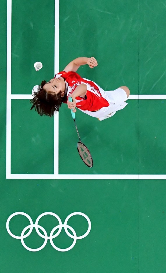 Chen Qingchen of China competes against Jongkolphan Kititharakul/Rawinda Prajongjai of Thailand during the Tokyo 2020 women's doubles group match in Tokyo, Japan, July 24, 2021.