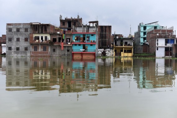 Houses are seen in the flood as the Ganga river swells after monsoon rains in Prayagraj district, India's northern state of Uttar Pradesh, Aug. 9, 2021.