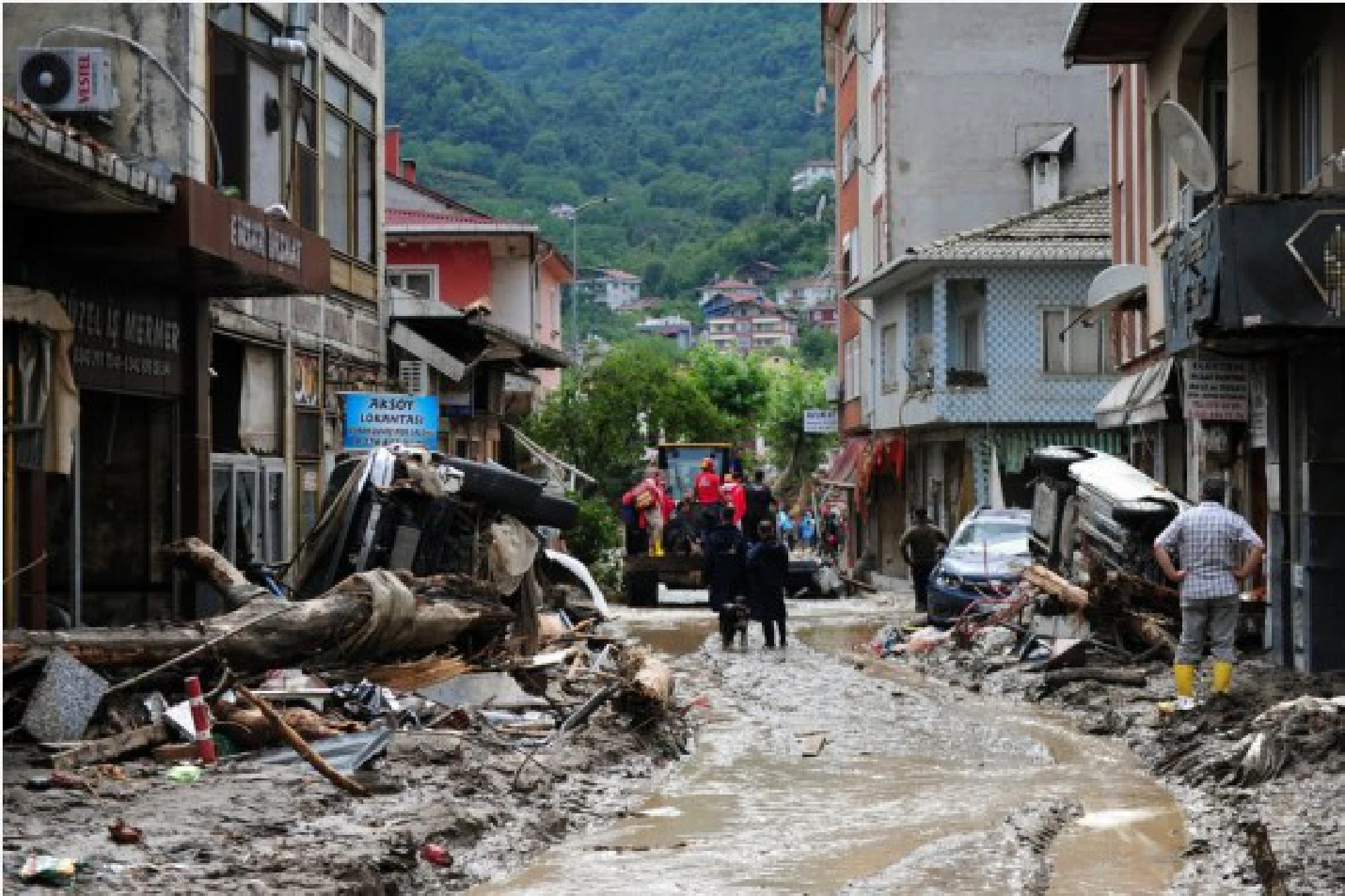 Rescuers work at a residential area affected by floods in Bozkurt district of Kastamonu province, Turkey, on Aug. 12, 2021. 