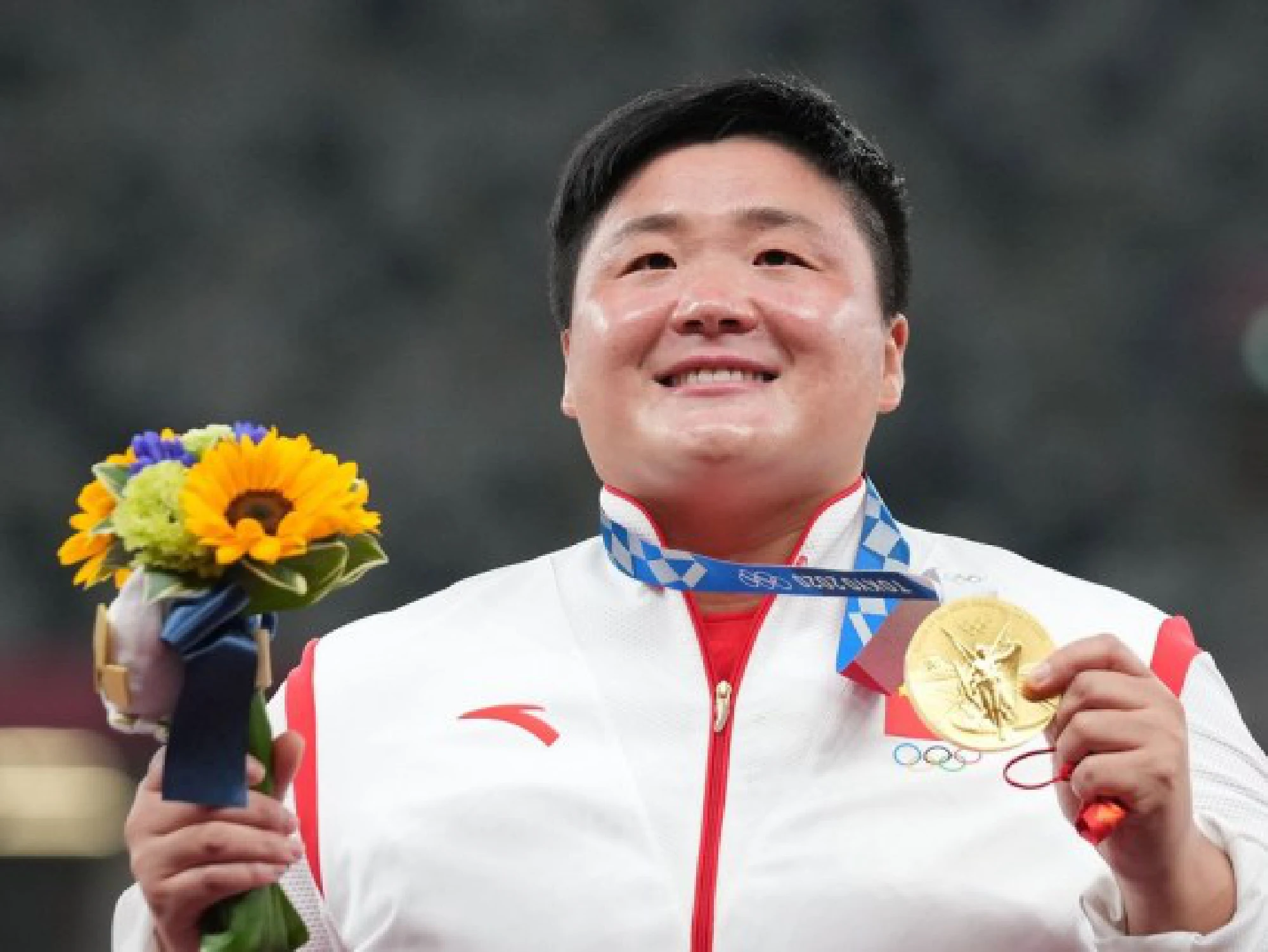 Gong Lijiao of China reacts during the awarding ceremony of the Women's Shot Put at the Tokyo 2020 Olympic Games in Tokyo, Japan, Aug. 1, 2021.