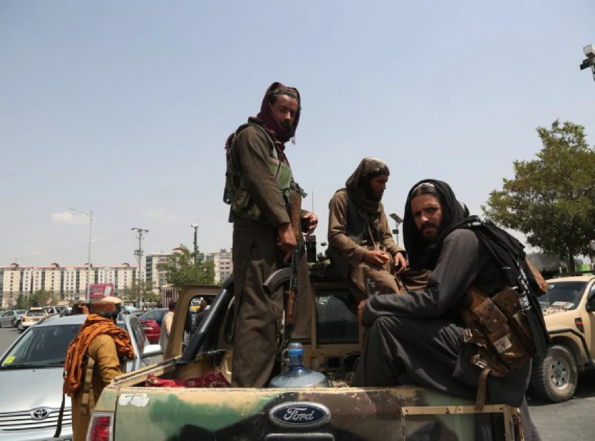 Taliban fighters are seen on a military vehicle in Kabul, capital of Afghanistan, Aug. 17, 2021.