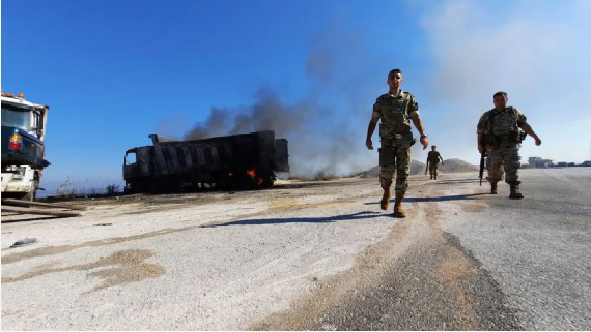 Members of the Lebanese army are evacuating civilians from the scene of the explosion in Akkar, northern Lebanon, on August 15, 2021.
