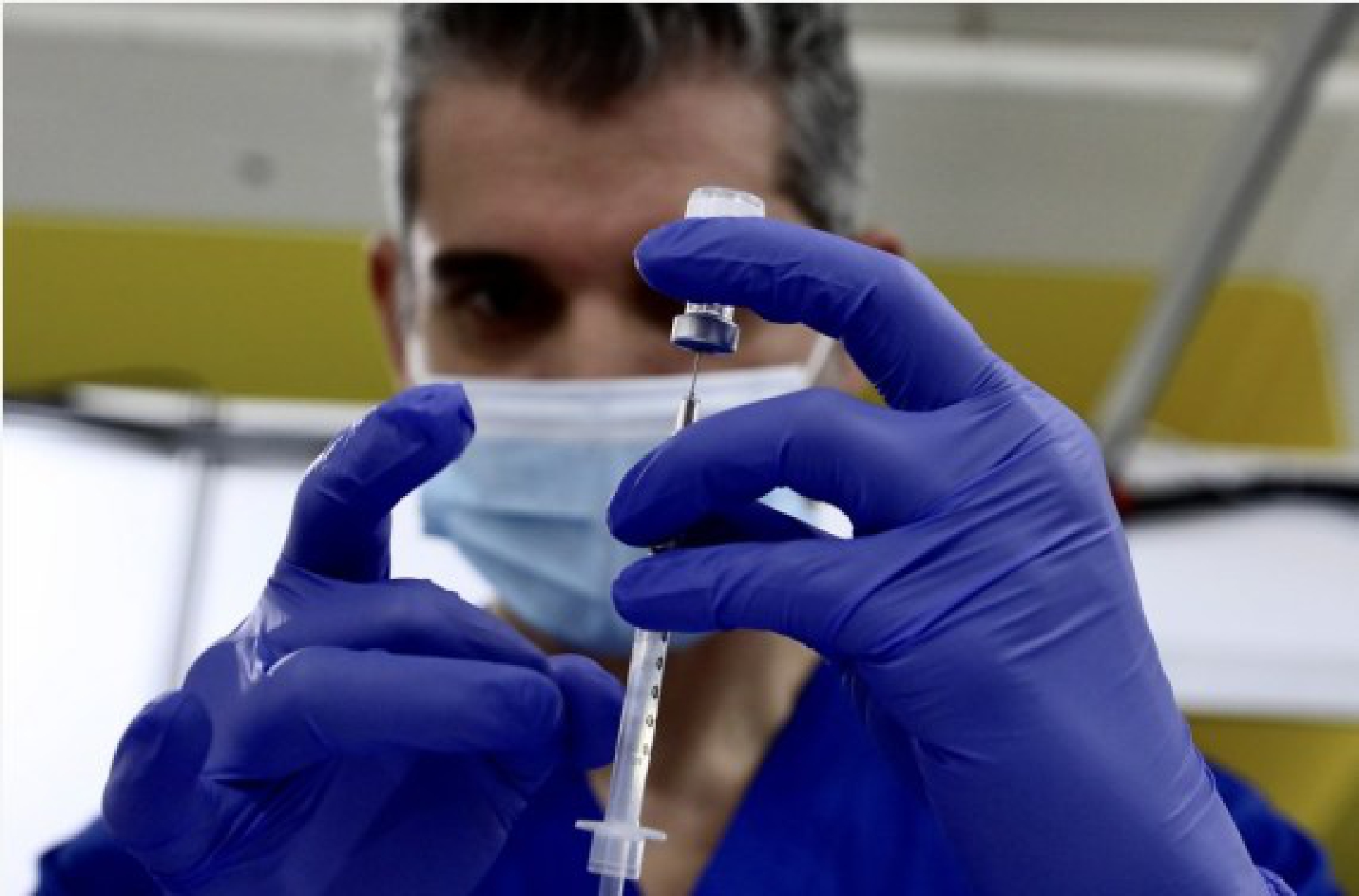 A health care worker prepares a dose of COVID-19 vaccine at a new vaccination site in the California Polytechnic State University in Pomona, Los Angeles County, California, the United States, Feb. 5, 2021.
