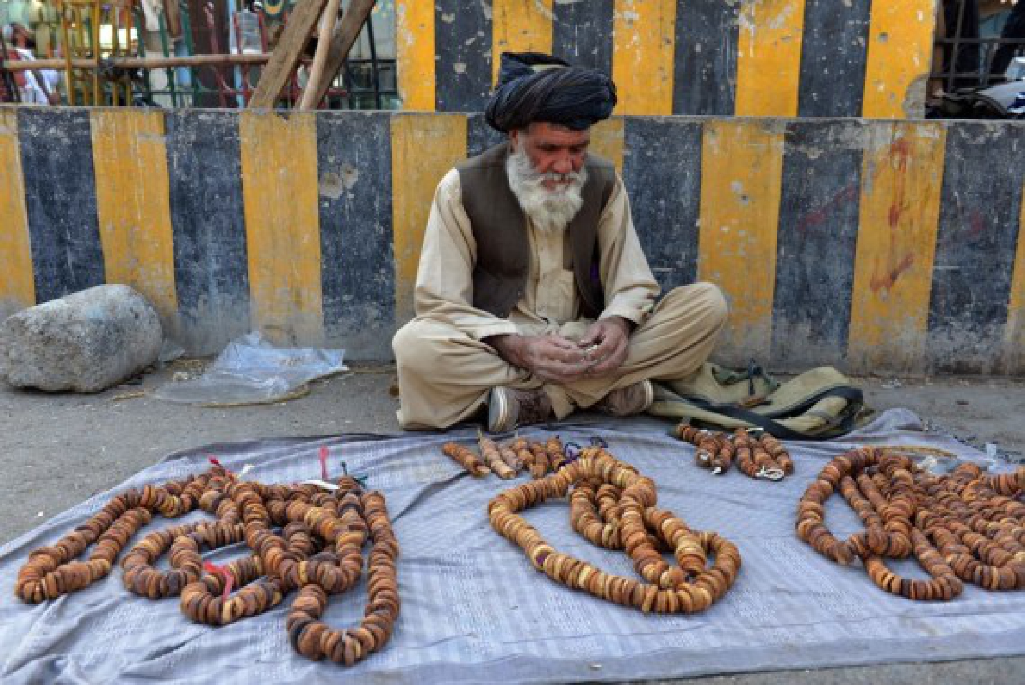 An Afghan vendor waits for consumers in Kandahar city, southern Afghanistan, Sept. 14, 2021. (Photo by Sanaullah Seiam/Xinhua)