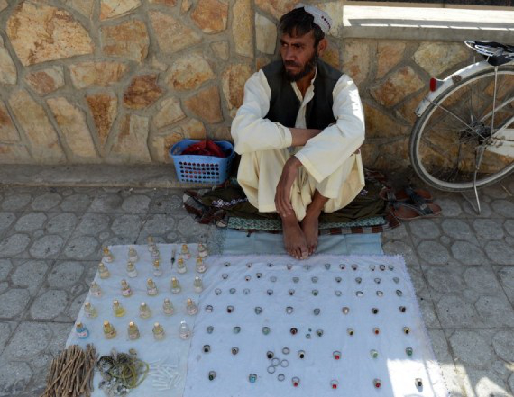 An Afghan vendor waits for customers in Kandahar city, southern Afghanistan, Sept. 14, 2021.
