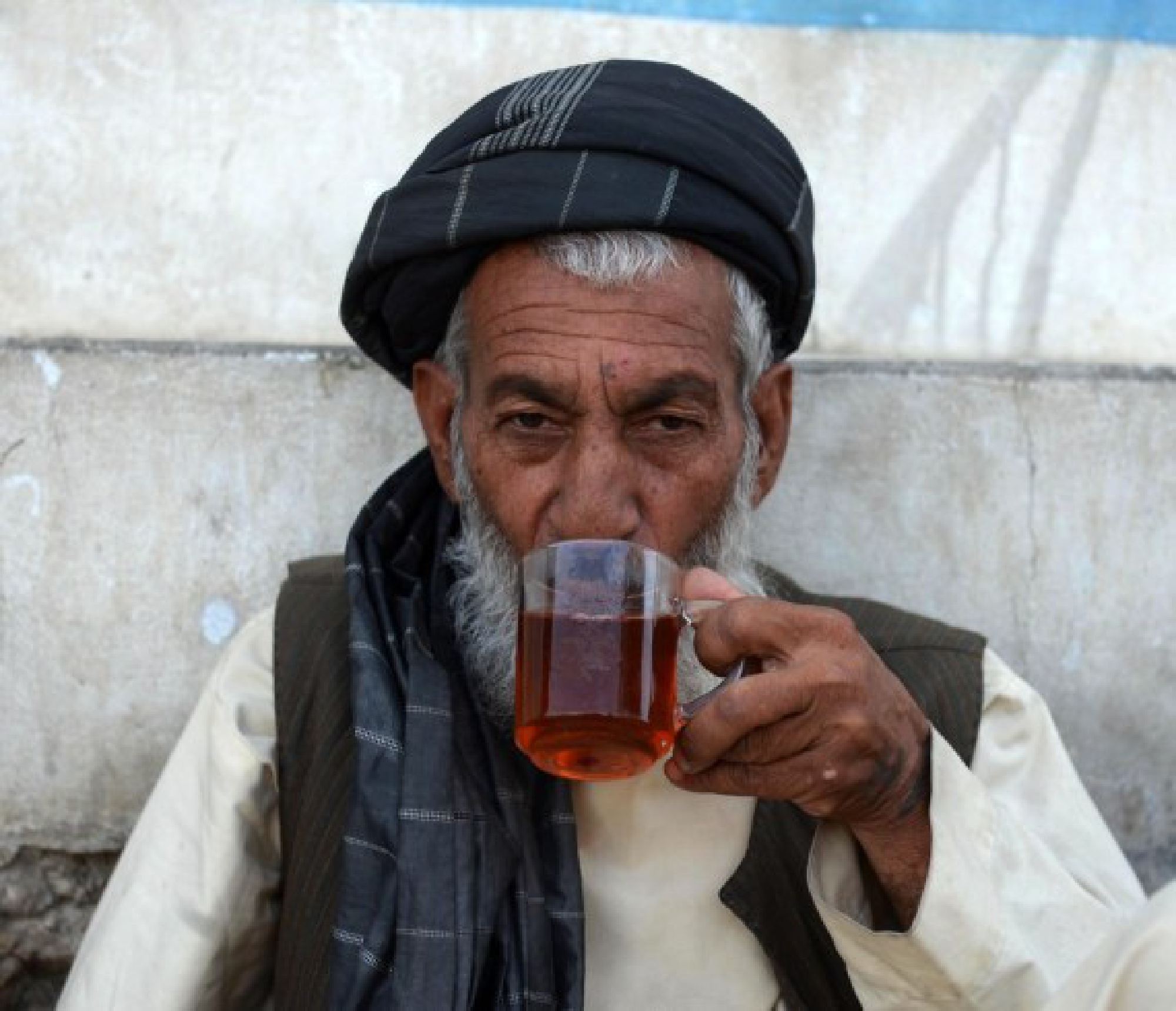 An Afghan man drinks tea in Kandahar city, southern Afghanistan, Sept. 14, 2021. (Photo by Sanaullah Seiam/Xinhua)