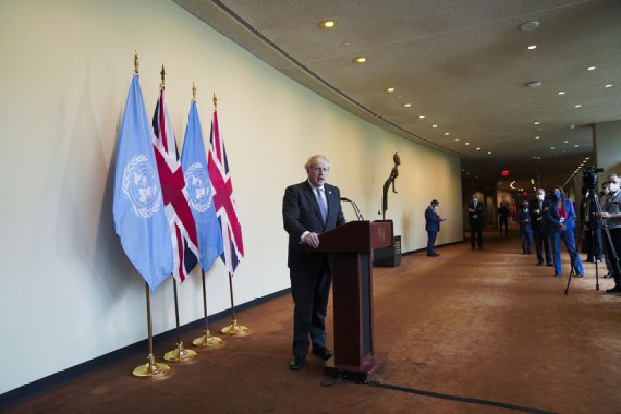 British Prime Minister Boris Johnson speaks to reporters after attending the Informal Leaders Roundtable on Climate Action at the UN headquarters in New York, on Sept. 20, 2021. (Xinhua/Wang Ying)