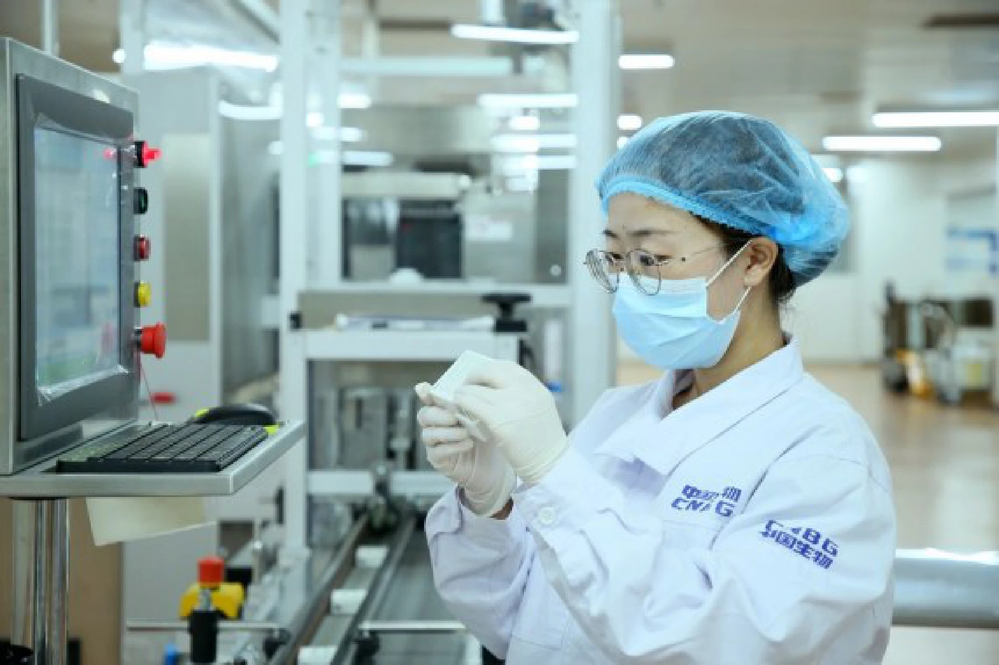 A staff member checks the packaging of the Sinopharm vaccines in Beijing, capital of China, May 31, 2021. 
