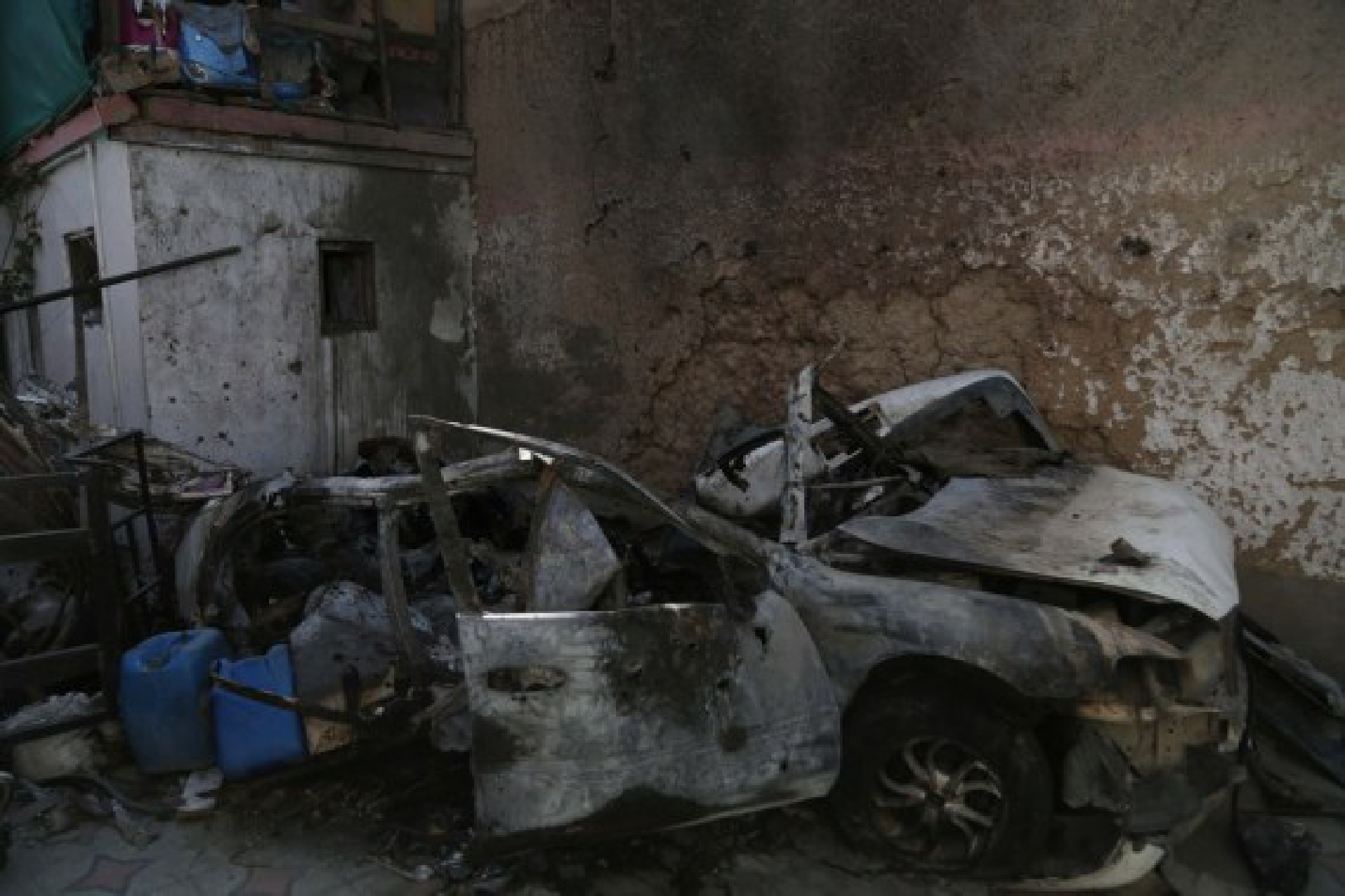 Photo taken on Sept. 2, 2021 shows a damaged vehicle at the site of the U.S. airstrike in Kabul, capital of Afghanistan. (Photo by Saifurahman Safi/Xinhua)