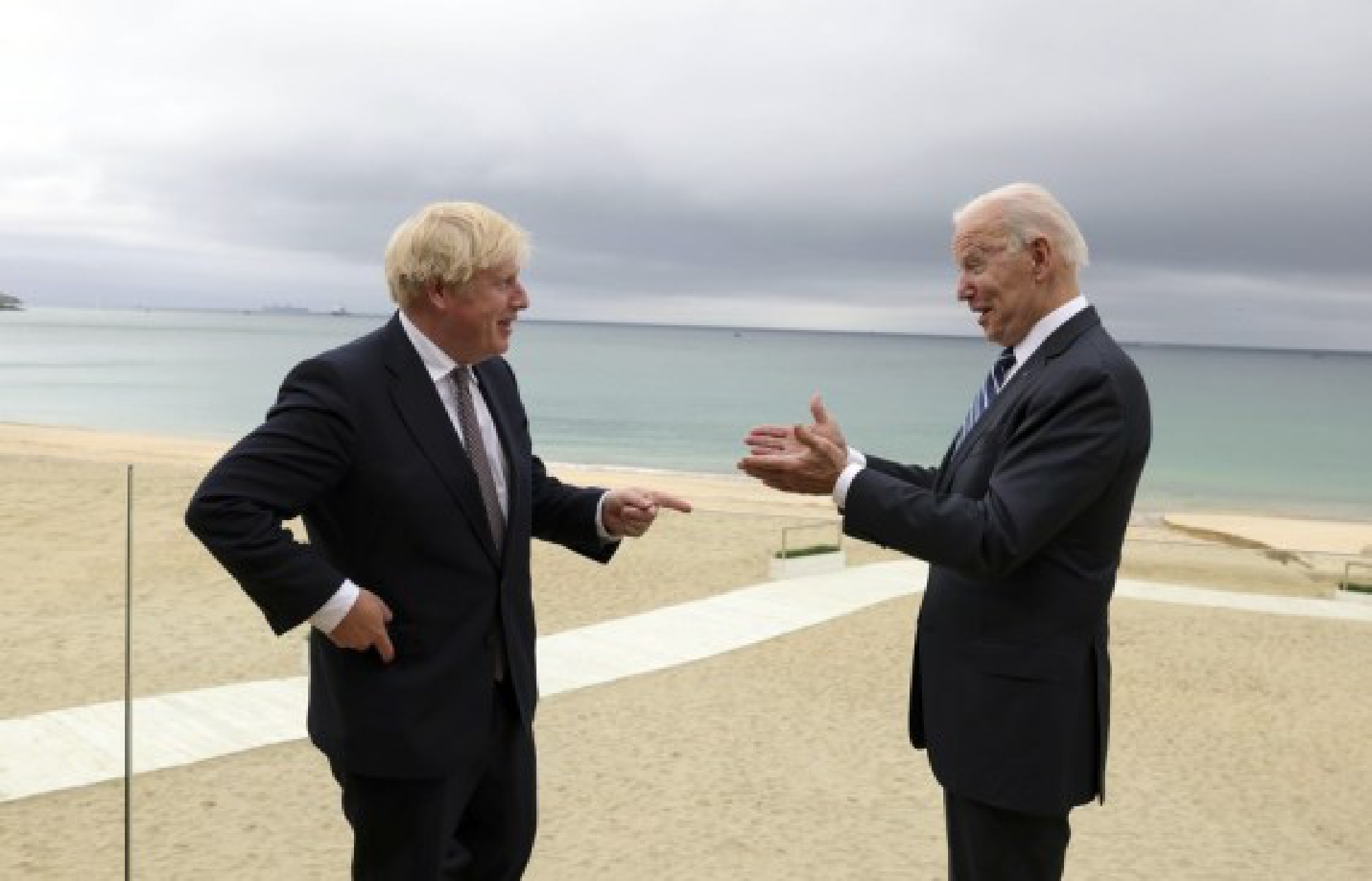British Prime Minister Boris Johnson (L) talks with U.S. President Joe Biden after their meeting in Carbis Bay, Cornwall, Britain, on June 10, 2021. (Andrew Parsons/No 10 Downing Street/Handout via Xinhua)