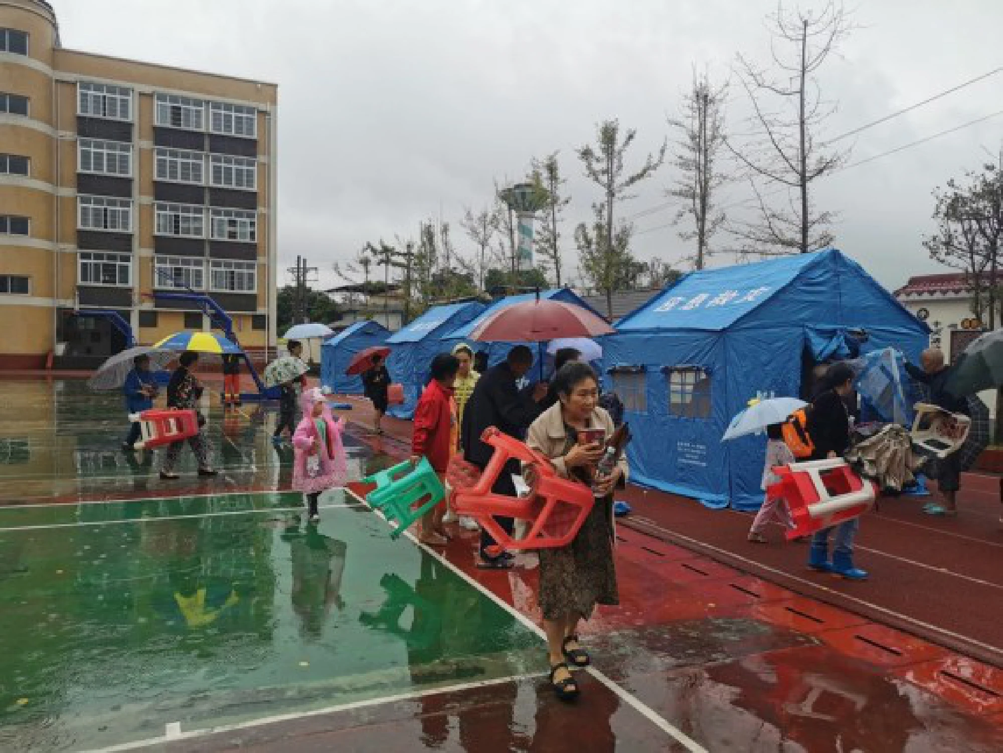 Evacuated people arrive at a temporary relocation site after an earthquake in Jiaming Township of Luxian County, southwest China's Sichuan Province, Sept. 16, 2021. (Photo by Liu Xueyi/Xinhua)