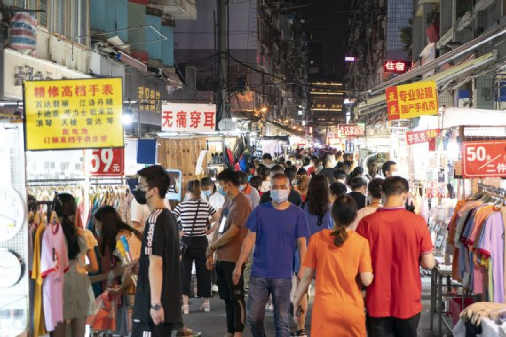 People visit a night market at Baocheng Road in Wuhan, central China's Hubei Province, June 1, 2020. 