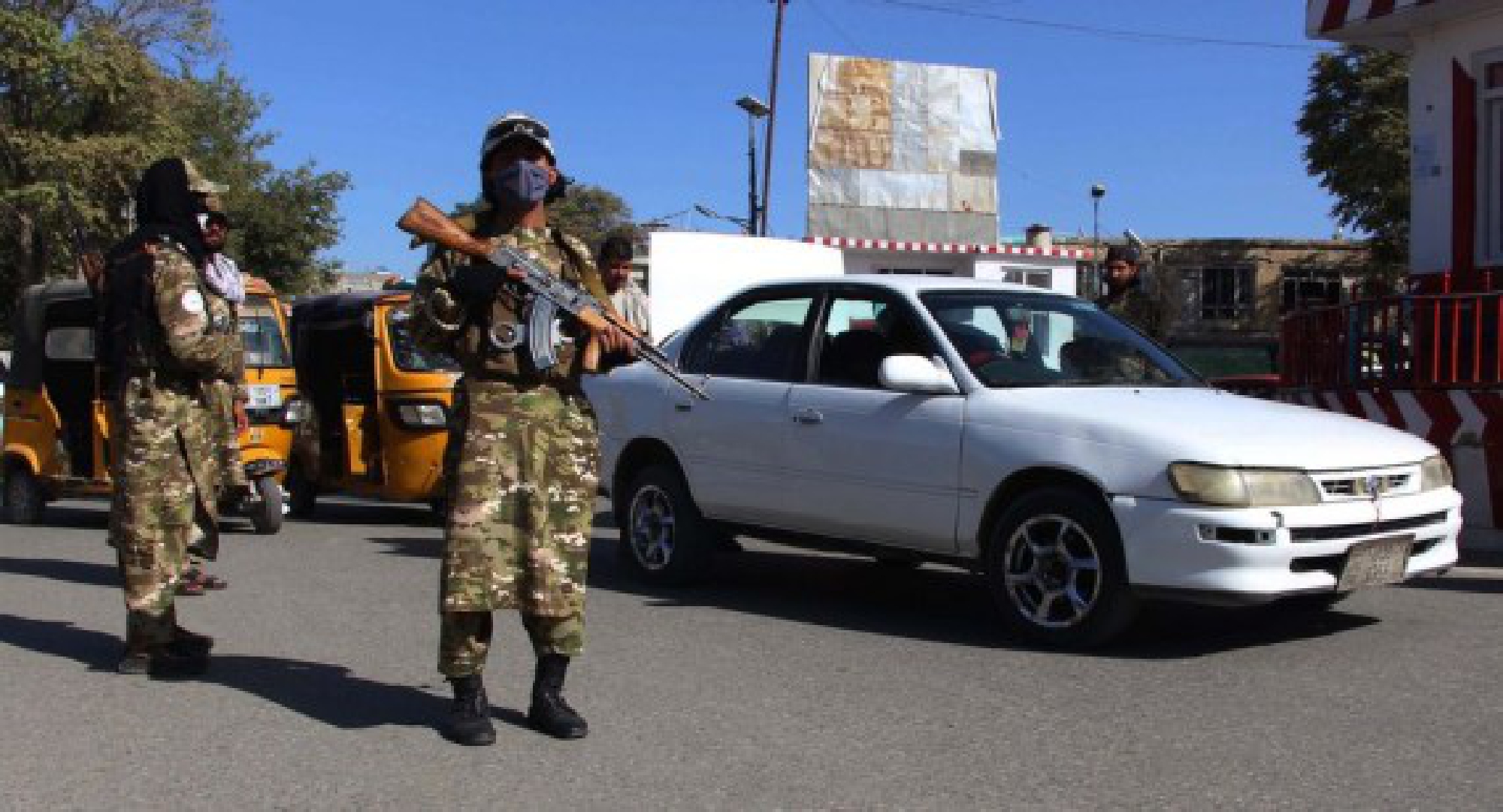 Afghan Taliban members stand guard at a security checkpoint in Kunduz, northern Afghanistan, on Sept. 15, 2021. (Photo by Ajmal Kakar/Xinhua)