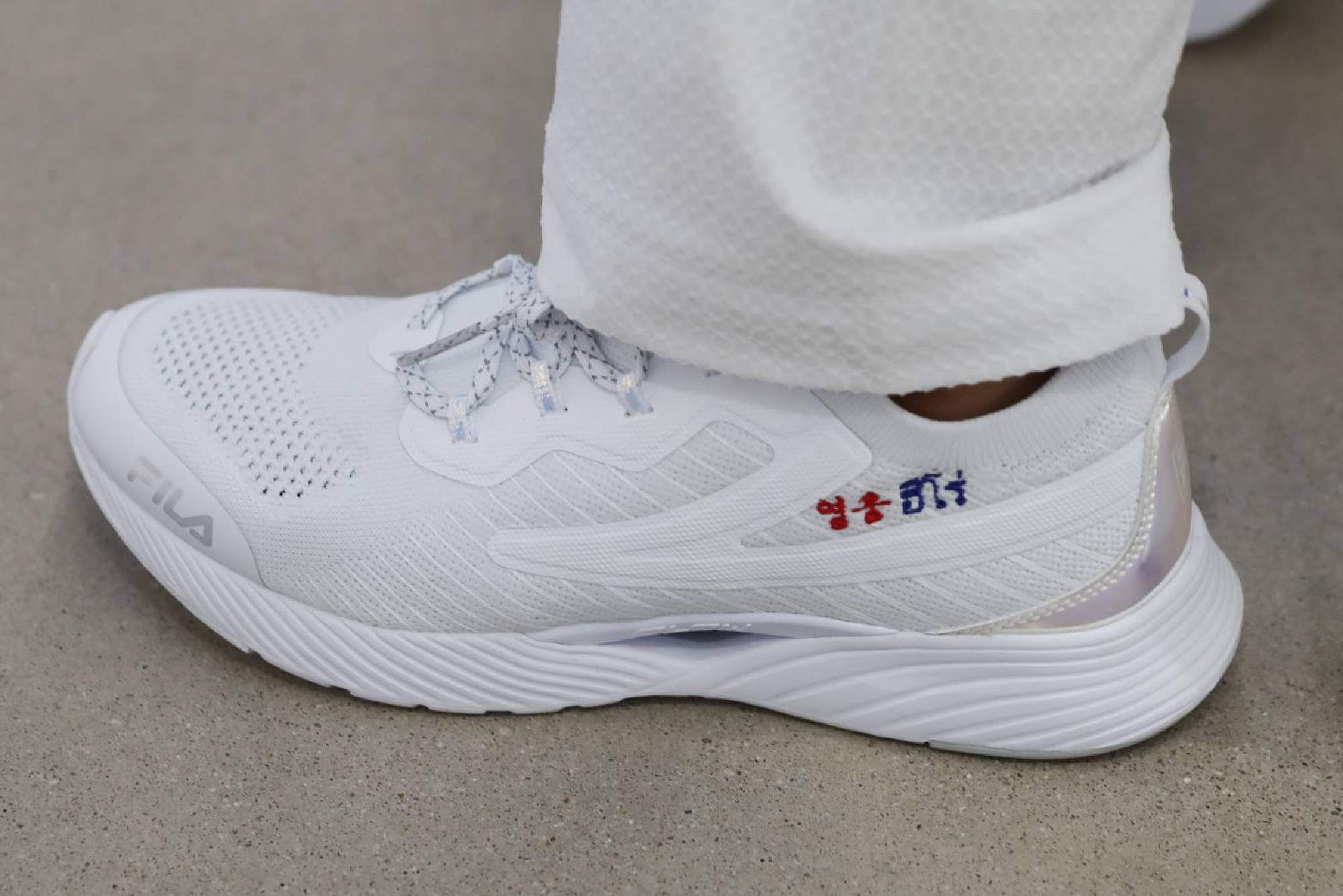 Training shoes H.E. Mr. Lee presents to Kwansuda with hoping for a good fight in the next game