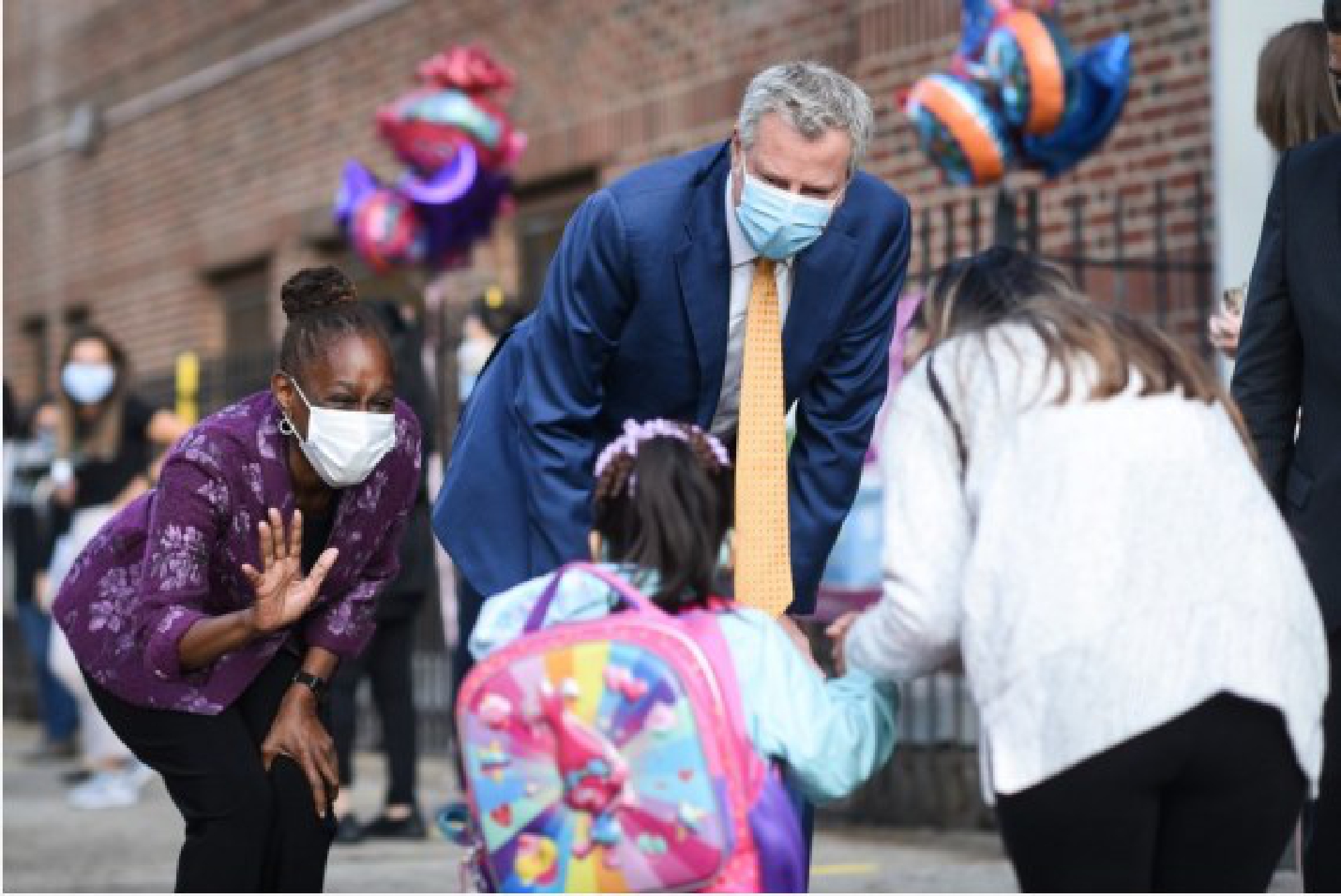 File photo taken on Sept. 21, 2020 shows that New York City Mayor Bill de Blasio (C) and his wife Chirlane McCray (1st L) welcome Pre-K students back to school at the Mosaic Pre-K Center in Queens, New York, the United States. (Photo by Michael Appleton/Mayoral Photography Office/Handout via Xinhua)