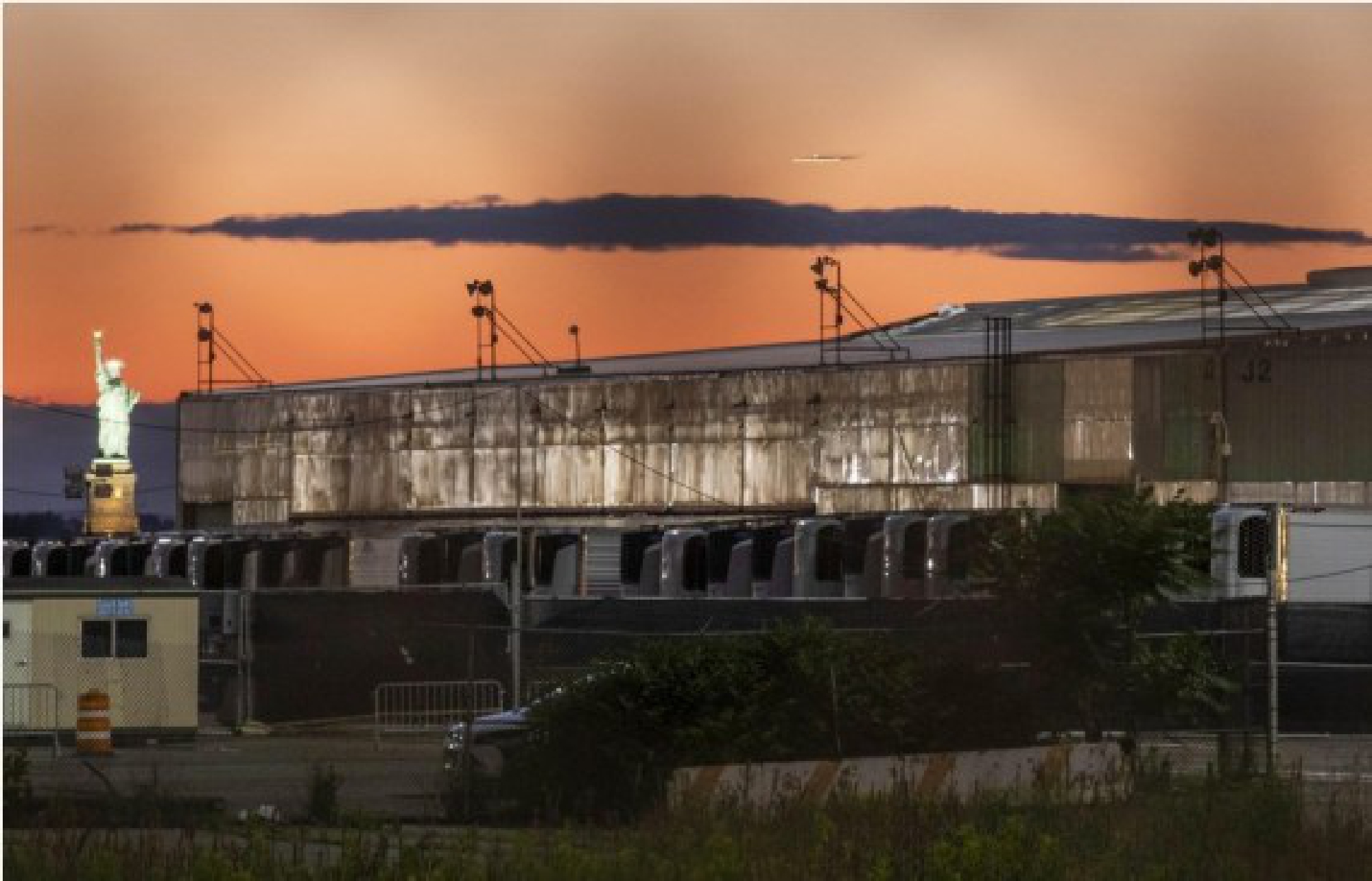 Refrigerated trailers are seen at a temporary morgue in Brooklyn, New York, the United States, June 15, 2021. 