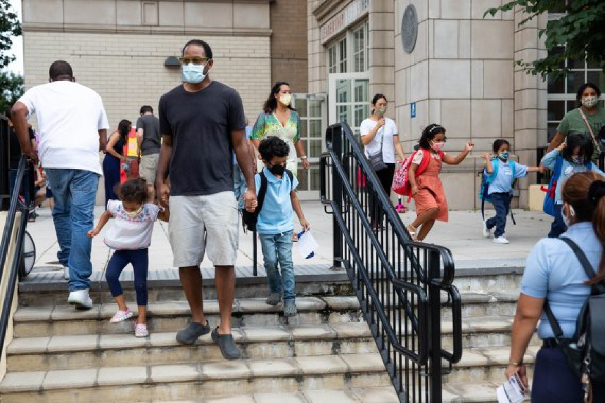 Students are dismissed from the first day of school at PS 133 in the Brooklyn borough of New York, the United States, on Sept. 13, 2021. (Photo by Michael Nagle/Xinhua)